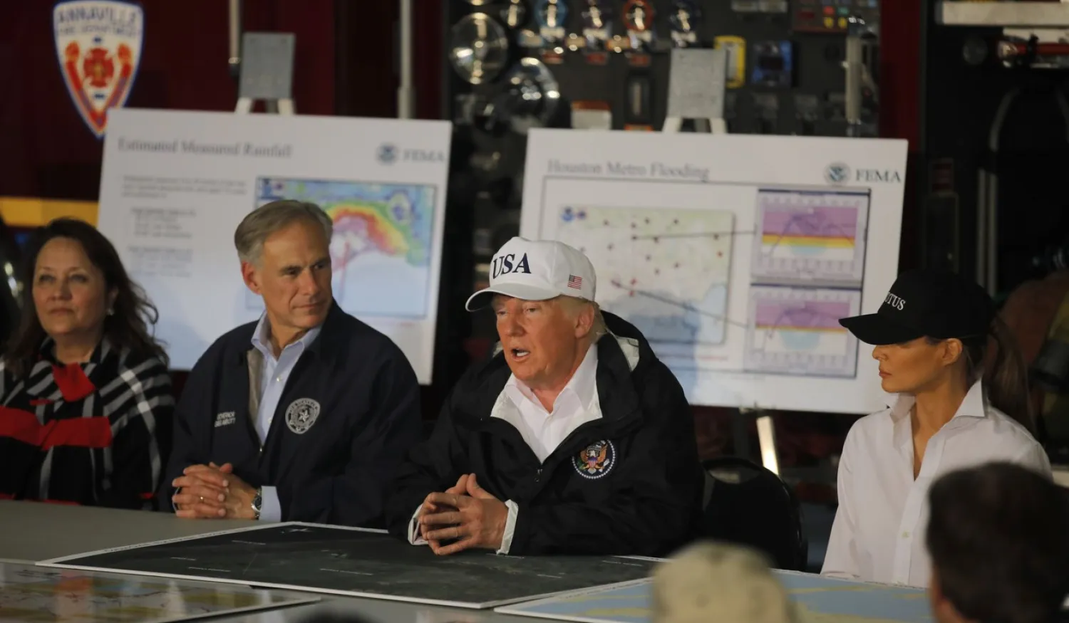 US President Donald Trump and first lady Melania Trump (R) receive a briefing on Tropical Storm Harvey relief efforts. Reuters