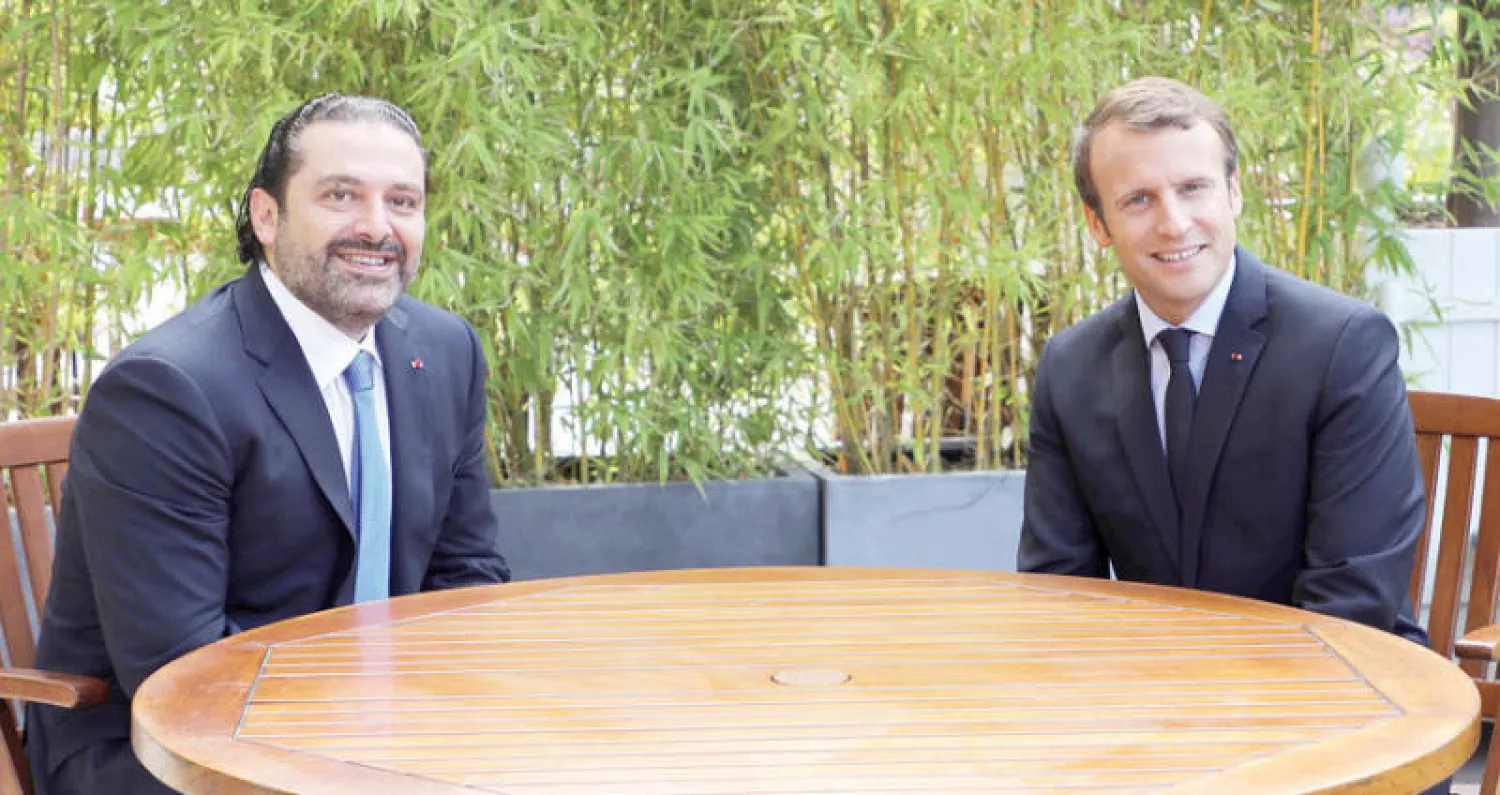 ماكرون خلال لقائه الحريري في باريس أول من أمس (أ.ب)