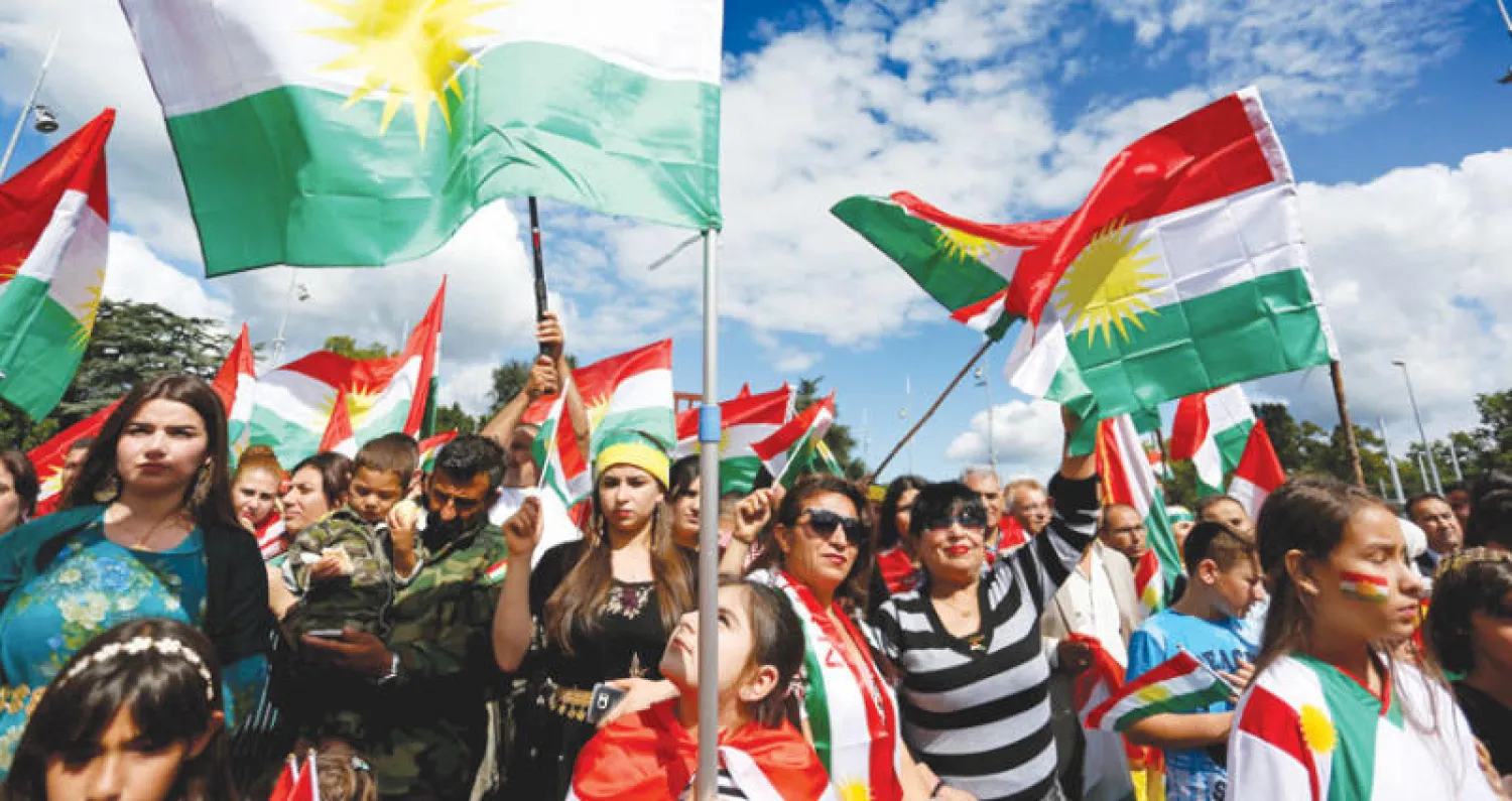 مسيرة كردية مؤيدة للاستفتاء في جنيف أمس (رويترز)