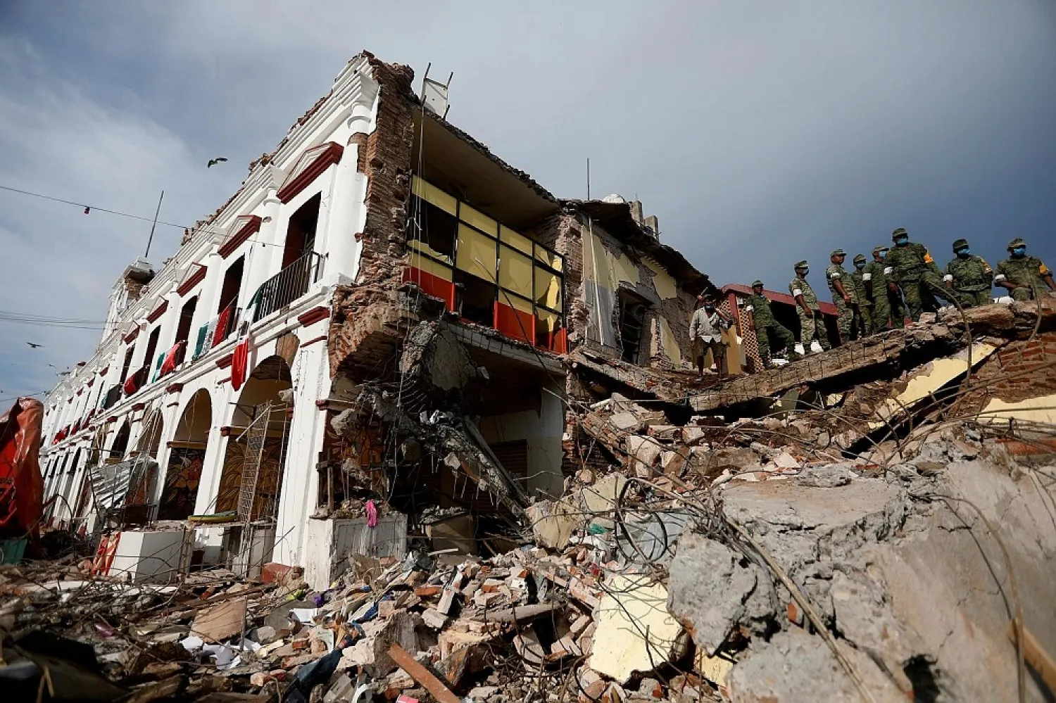 Soldiers are seen at the ruins of a building destroyed by last week’s earthquake in Juchitan, in Oaxaca, Mexico. (Reuters)