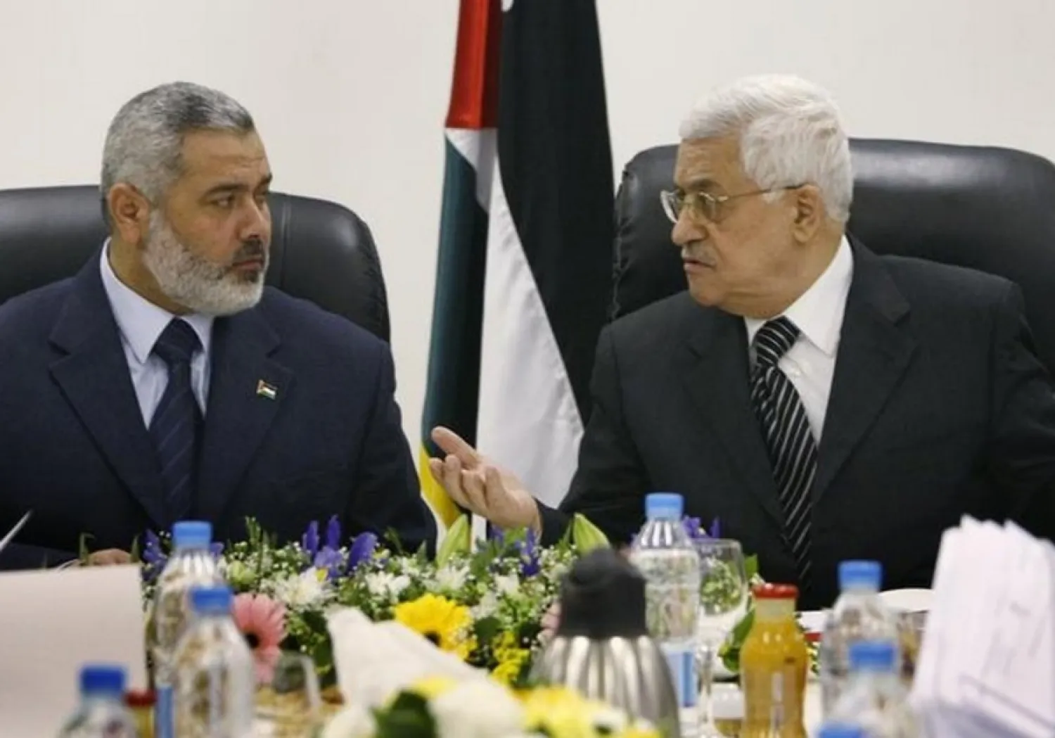 Palestinian President Mahmoud Abbas and Hamas chief Ismail Hanieh. (Reuters)