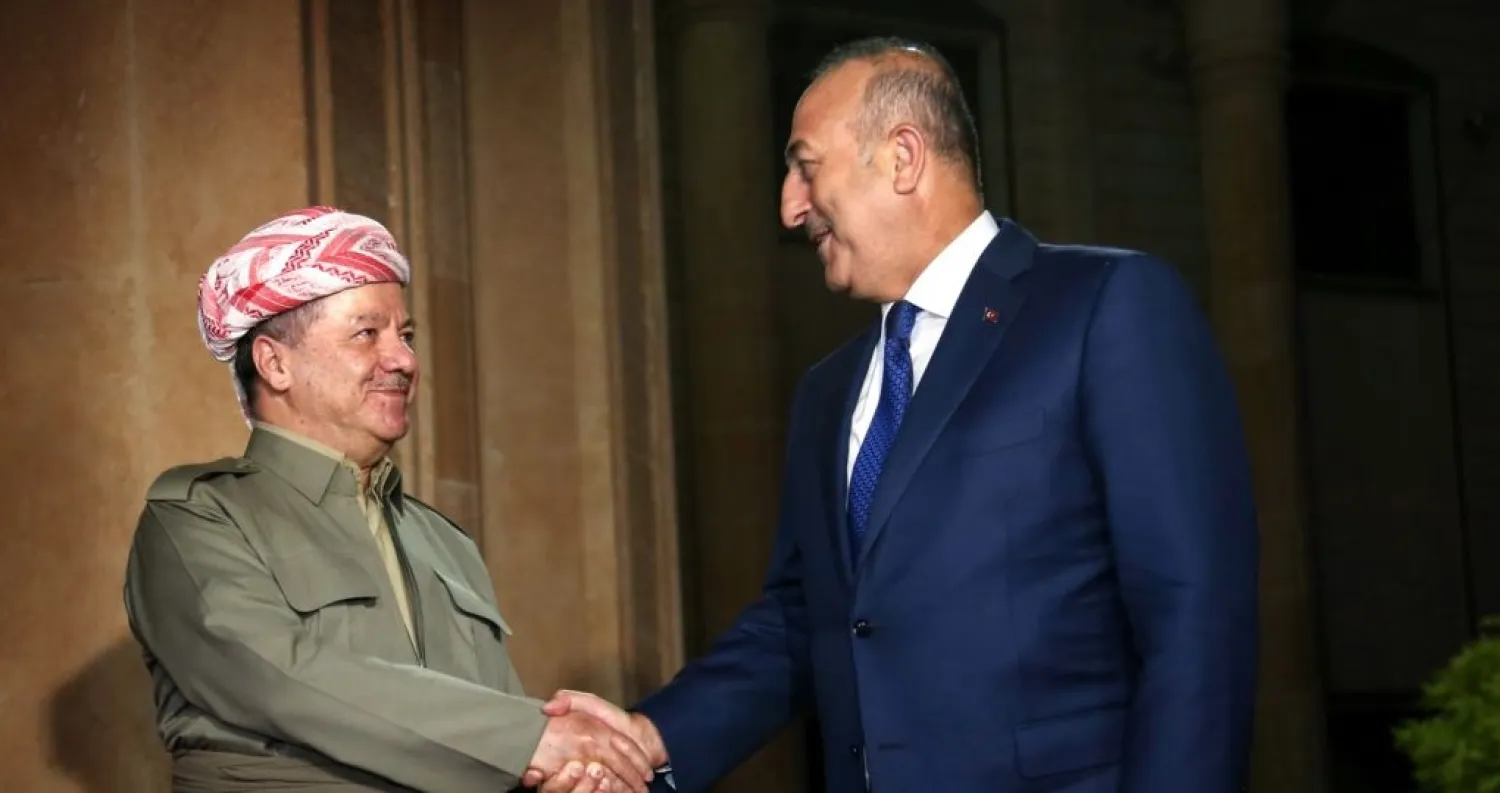 The president of Iraq's Kurdish autonomous region, Masud Barzani (left), meets with Turkish Foreign Minister Mevlut Cavusoglu in Irbil. AFP file photo