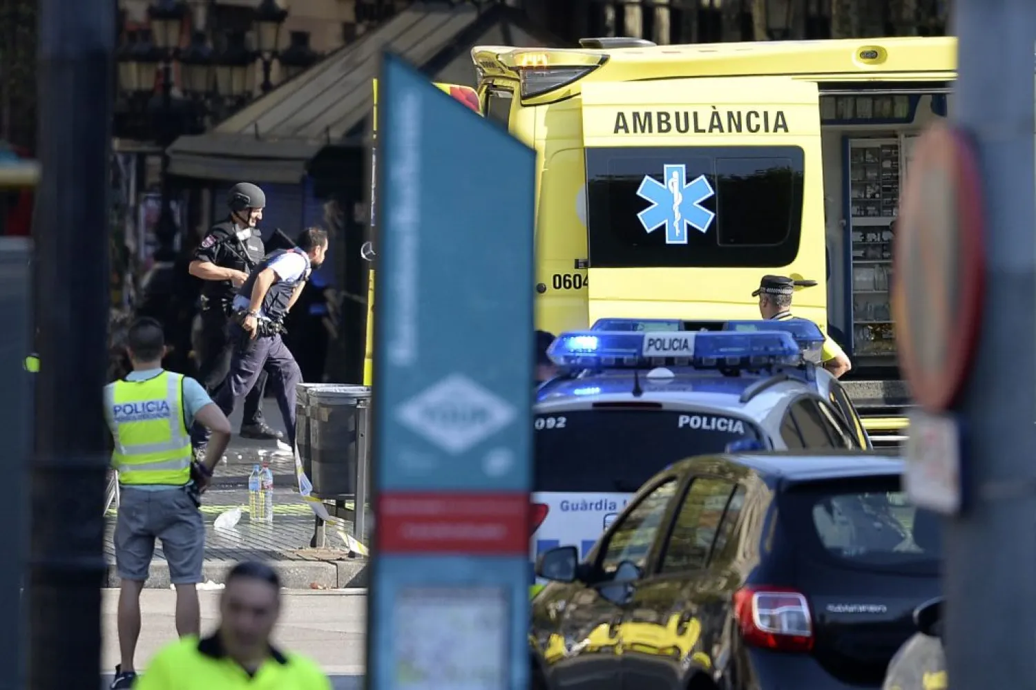 Armed policemen arrive in a cordoned off area after a van ploughed into the crowd on the Rambla in Barcelona. AFP file photo