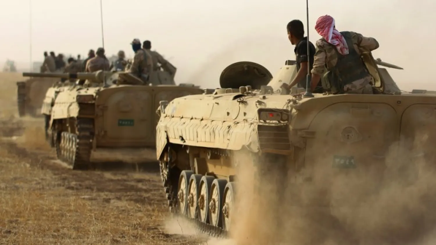 Iraqi forces' Russian-made BMP infantry-fighting vehicles (IFVs) advance towards the city of Sharqat on September 21, 2017. (AFP)