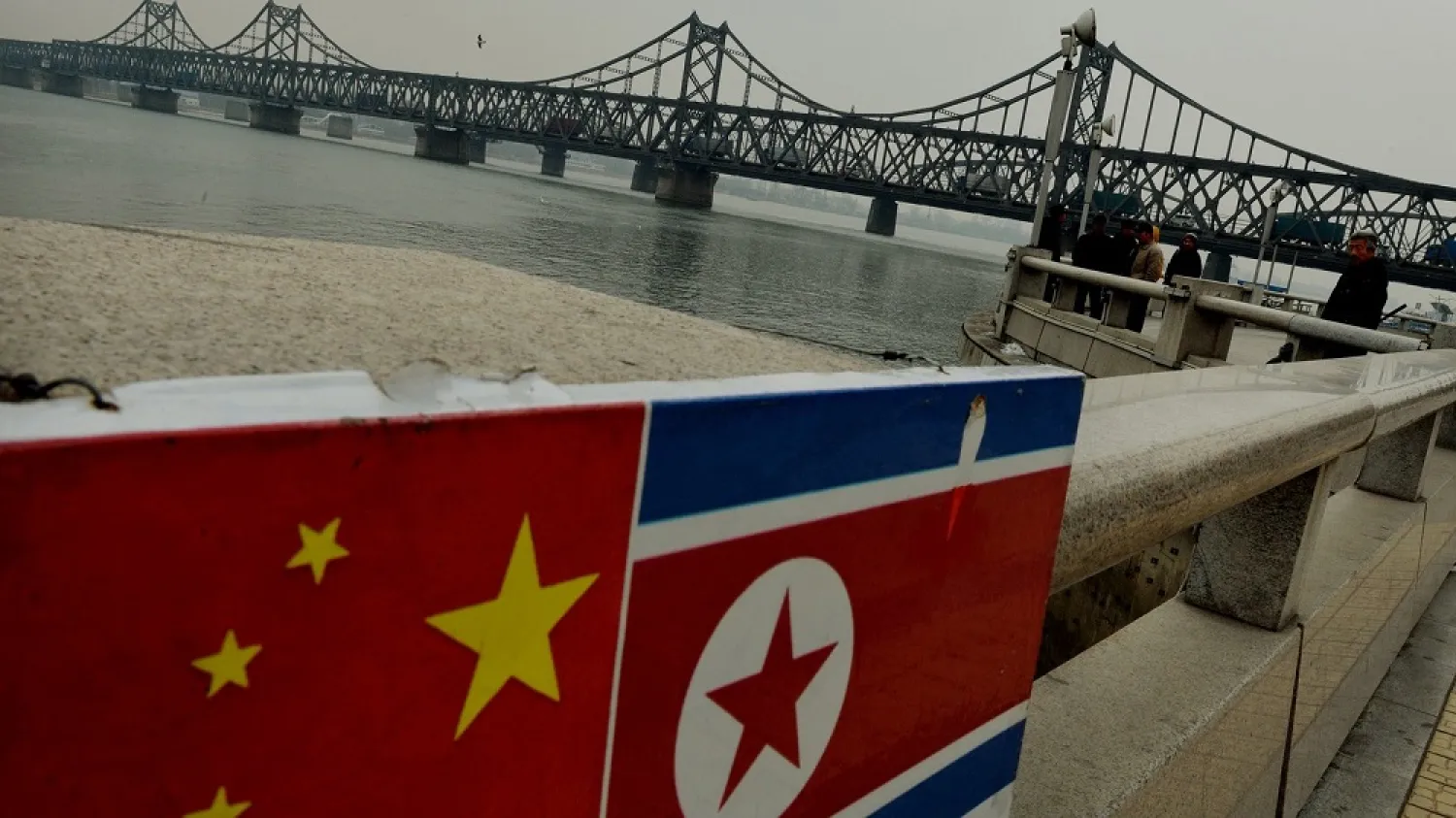 Trucks cross the China-Korea Friendship Bridge into Dandong, North Korea. (AFP)