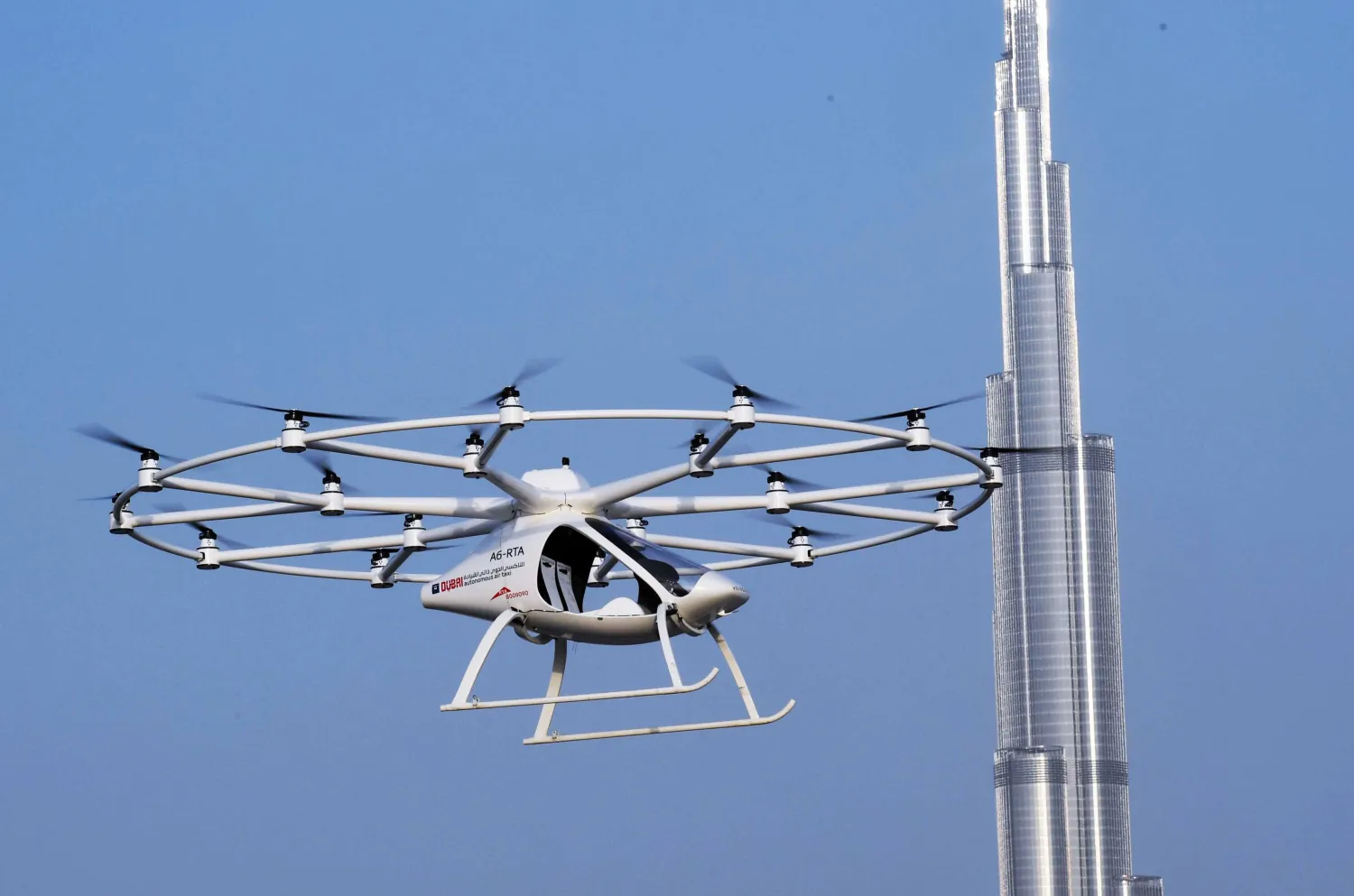 A handout image provided by United Arab Emirates News Agency (WAM) on September 25, 2017 shows a two-seater "hover taxi" flying in a "concept" flight in Dubai. AFP PHOTO
