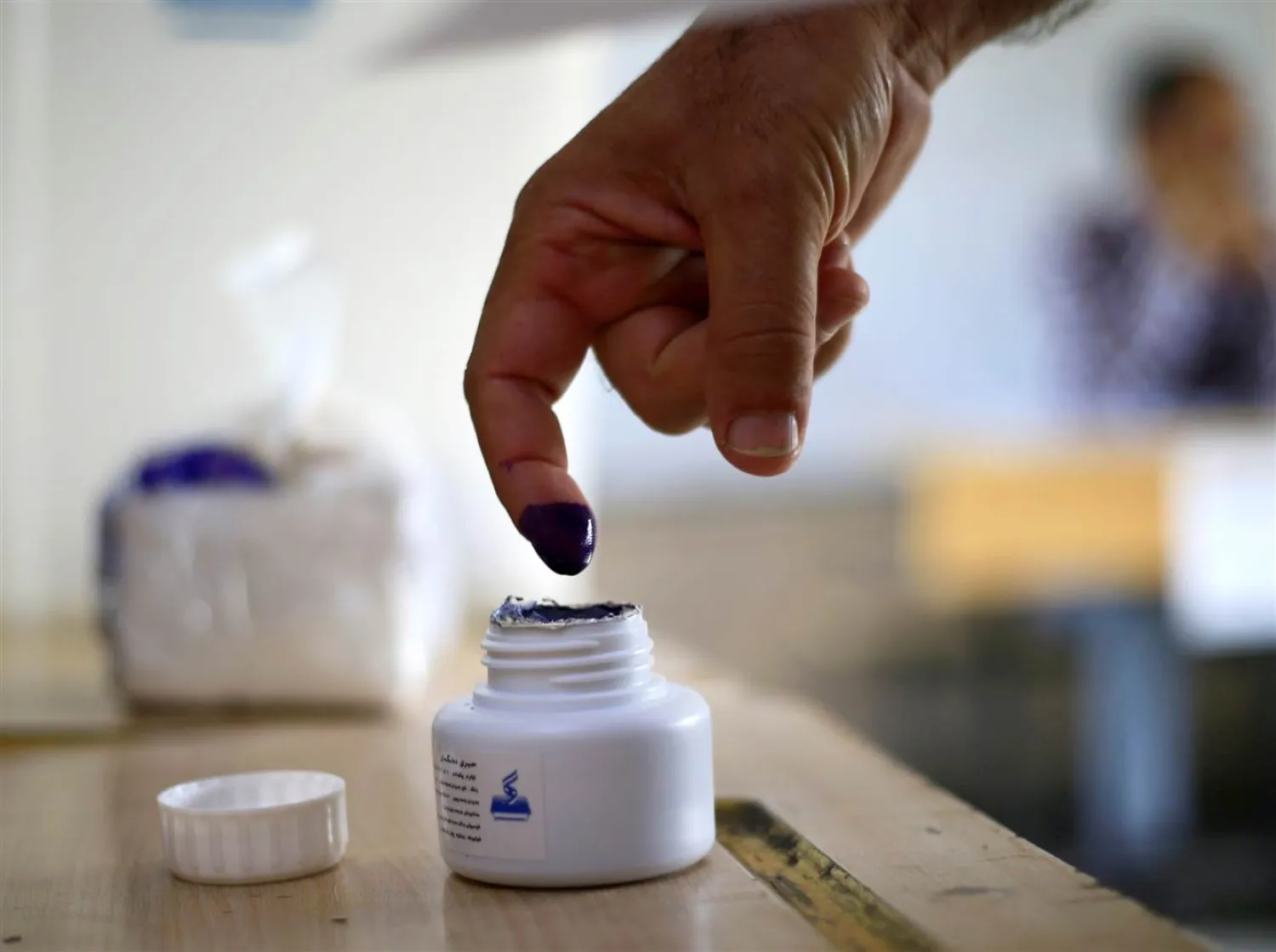 A man stains his finger with ink during the Kurdistan independence referendum in Kirkuk, Iraq, on Monday. Thaier Al-Sudani / Reuters