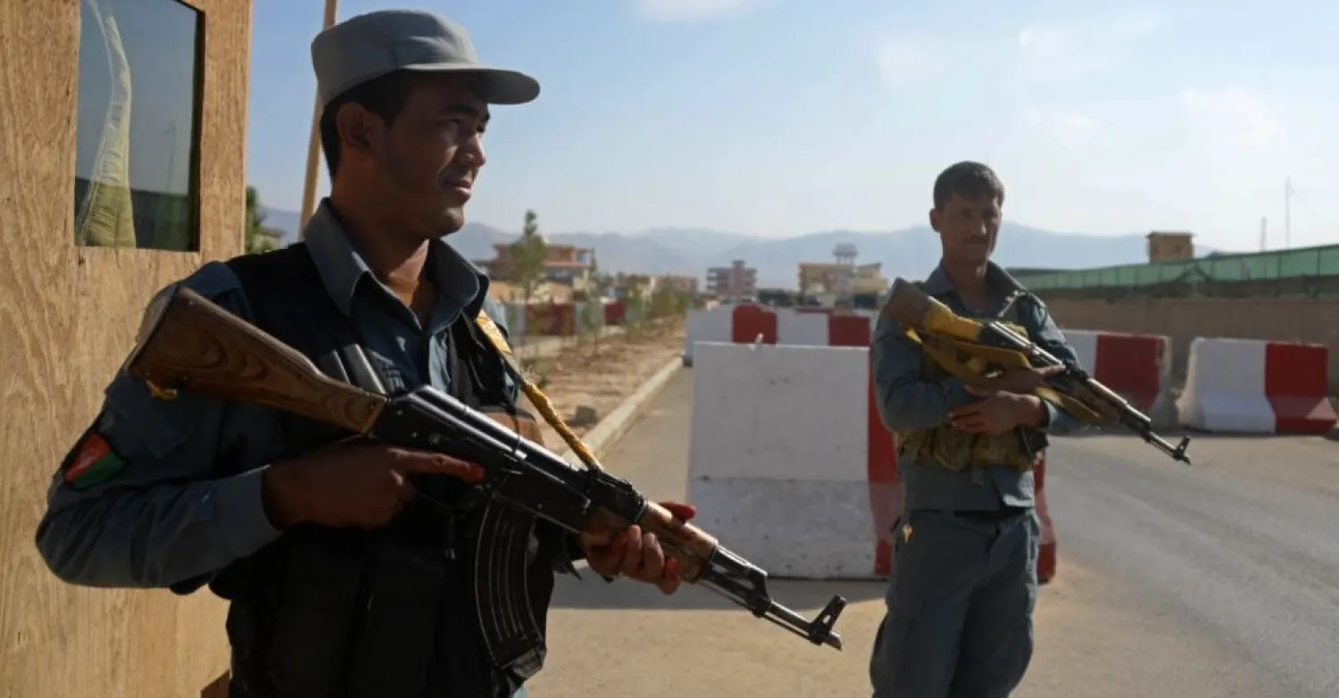 Afghan policemen keep watch in Mazar-i-sharif, Oct. 12, 2014. AFP file photo