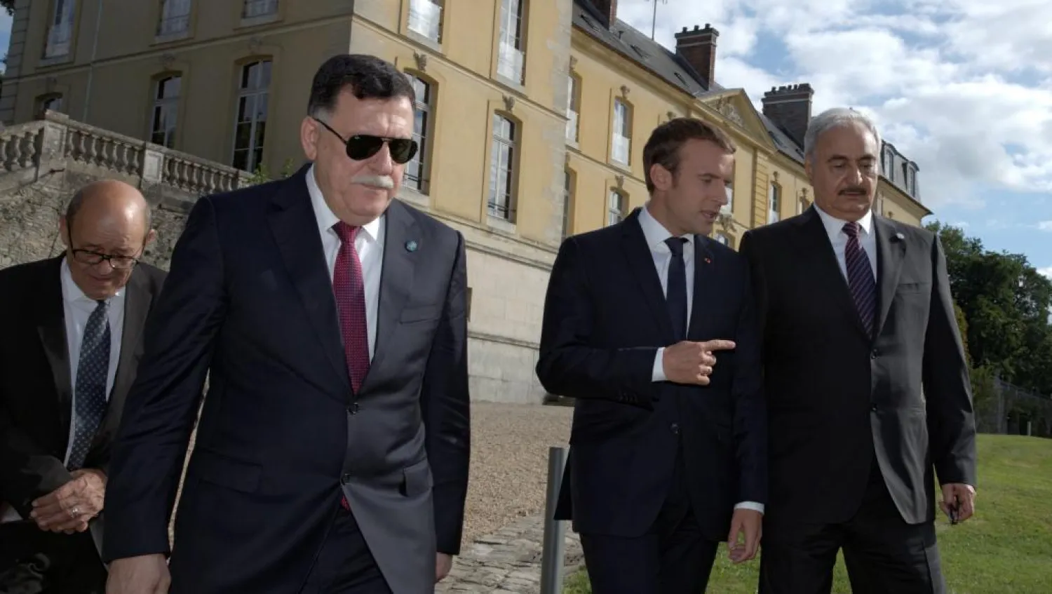 Libyan Prime Minister Fayez al-Sarraj, French President Emmanuel Macron and Field Marshall Khalifa Haftar in Paris, July 25, 2017 (REUTERS/Philippe Wojazer)