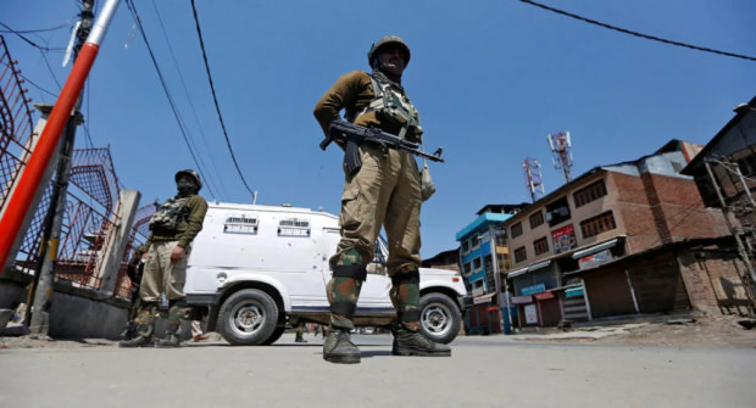 Indian policemen guard a deserted street during restrictions in downtown Srinagar April 10, 2017, Reuters