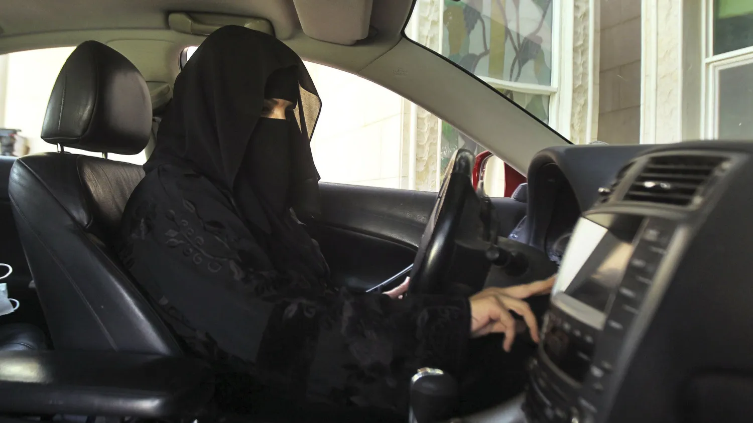 Saudi woman sitting behind the driving wheel. Reuters
