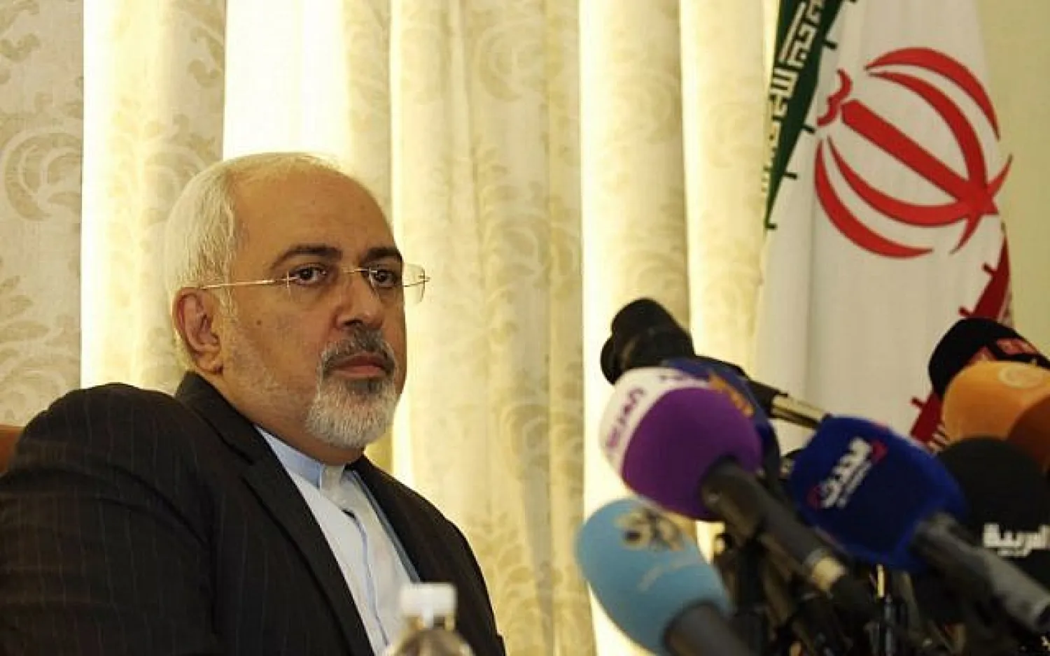 Iranian Foreign Minister Mohammad Javad Zarif holds a press conference on September 1, 2015, at the residence of the Iranian ambassador in the Tunisian capital Tunis. (AFP PHOTO/SALAH LAHBIBI)