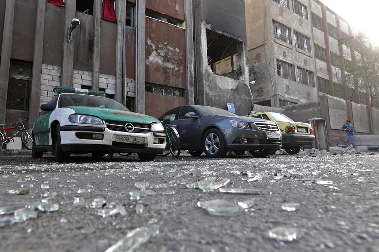 Debris lie on the ground at the site of a double suicide bomb attack which hit the al-Midan police station in Syria’s capital Damascus on October 2, 2017. (AFP)