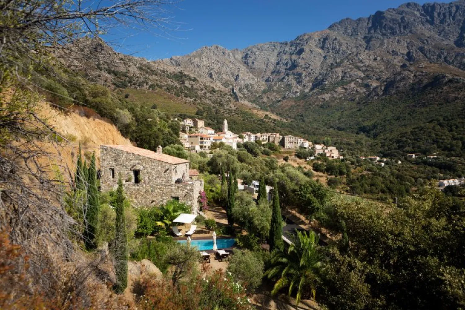 A two-story, three-bedroom stone villa that blends into the mountains in Zilia, Corsica, is on the market for $1.76 million. Credit Rebecca Marshall for The New York Times