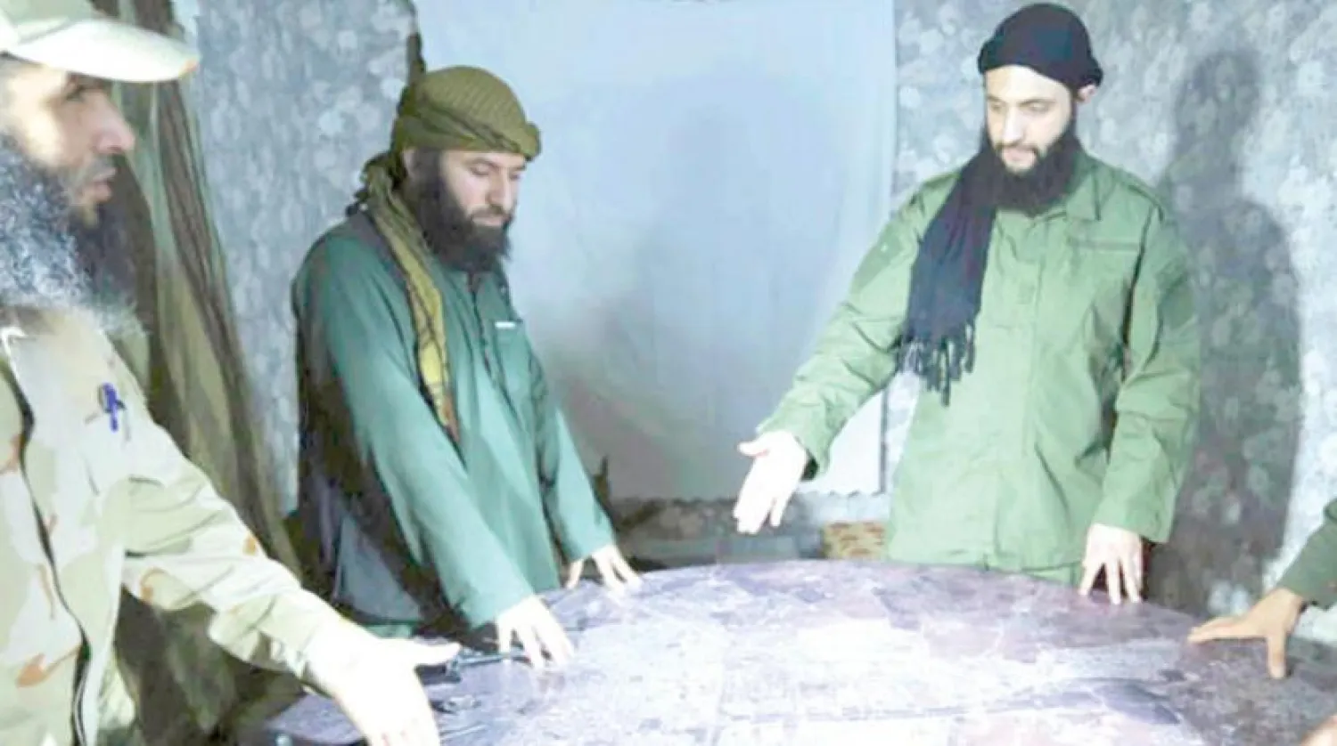 Al-Nusra Front leader Abu Mohammed al-Jolani meeting with several group commanders ahead of the Aleppo battles last year. AP photo