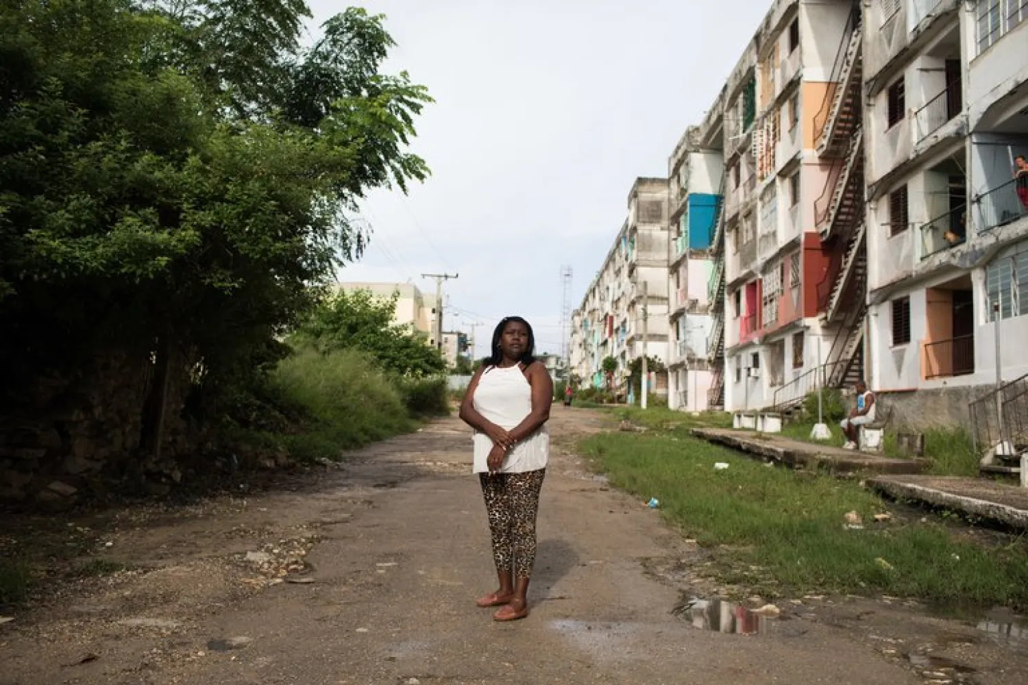 Irene Hierrezuelo outside her home in Havana. She is counting the days to be reunited with her daughter, Sulay Falconet, who moved to Houston in 2012. Credit Lisette Poole for The New York Times