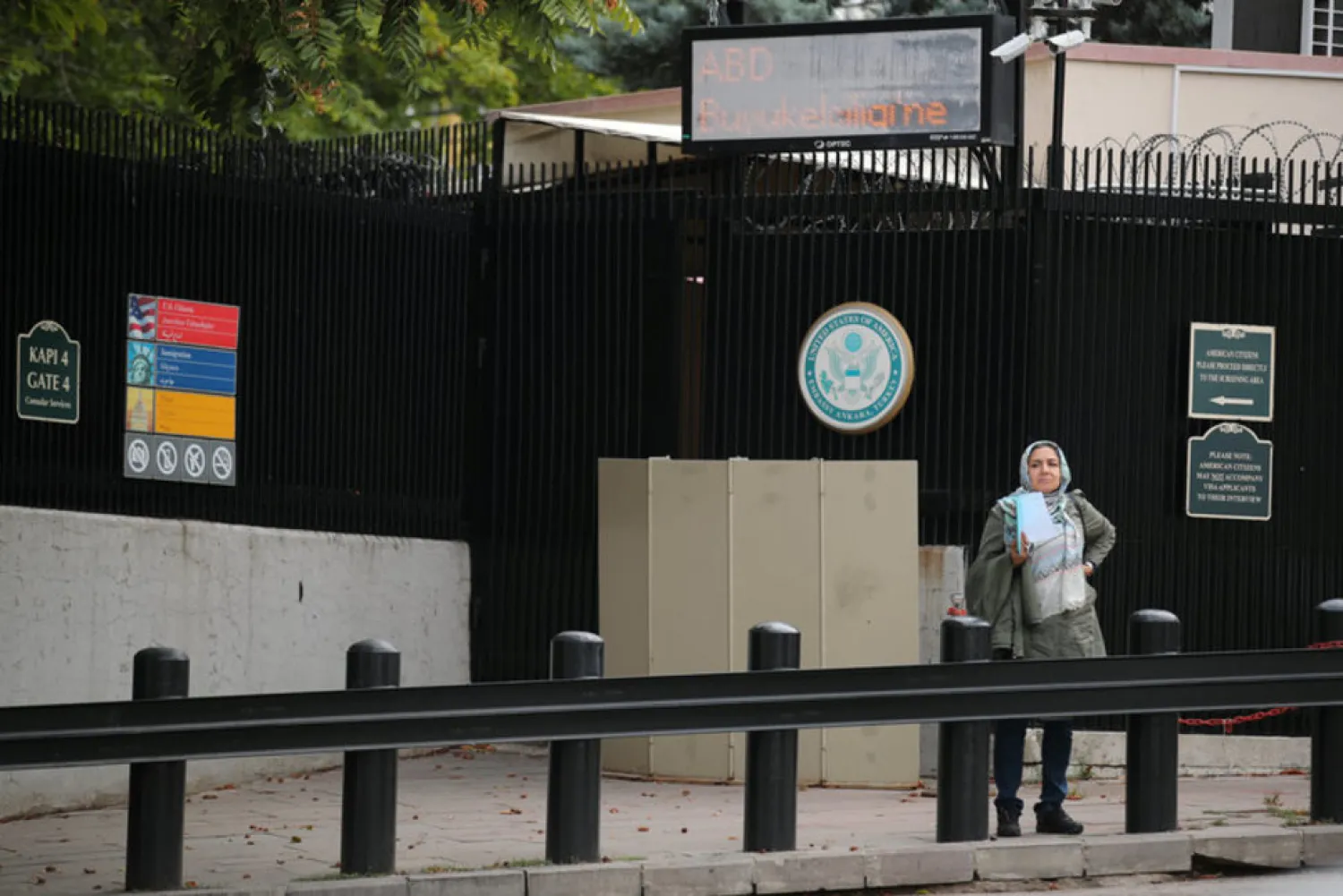 A woman waits in front of the visa application office entrance of the US Embassy in Ankara, Turkey, October 9, 2017. (Reuters)