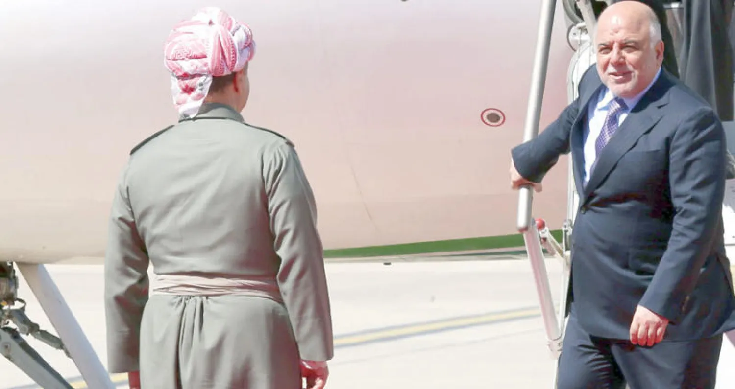 العبادي في زيارة سابقة إلى أربيل حيث استقبله البارزاني (أ.ف.ب)