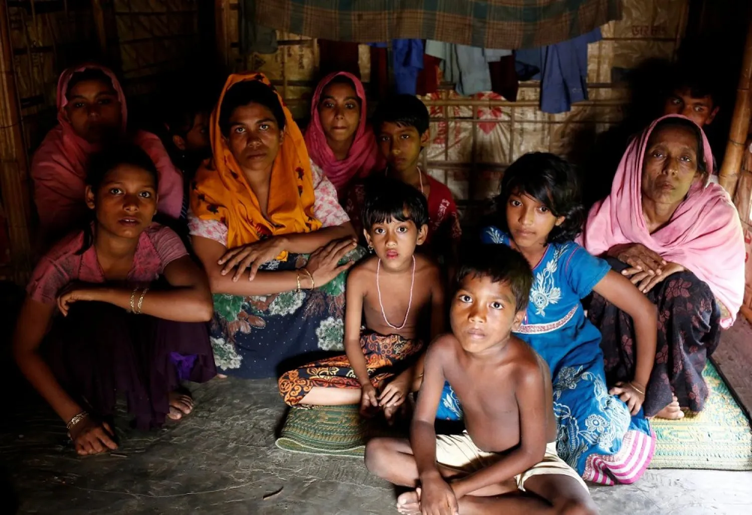 A group of Rohingya refugees takes shelter at the Kutuupalang makeshift refugee camp, after crossing the Myanmar-Bangladesh border in Cox's Bazar, Bangladesh. (Reuters)