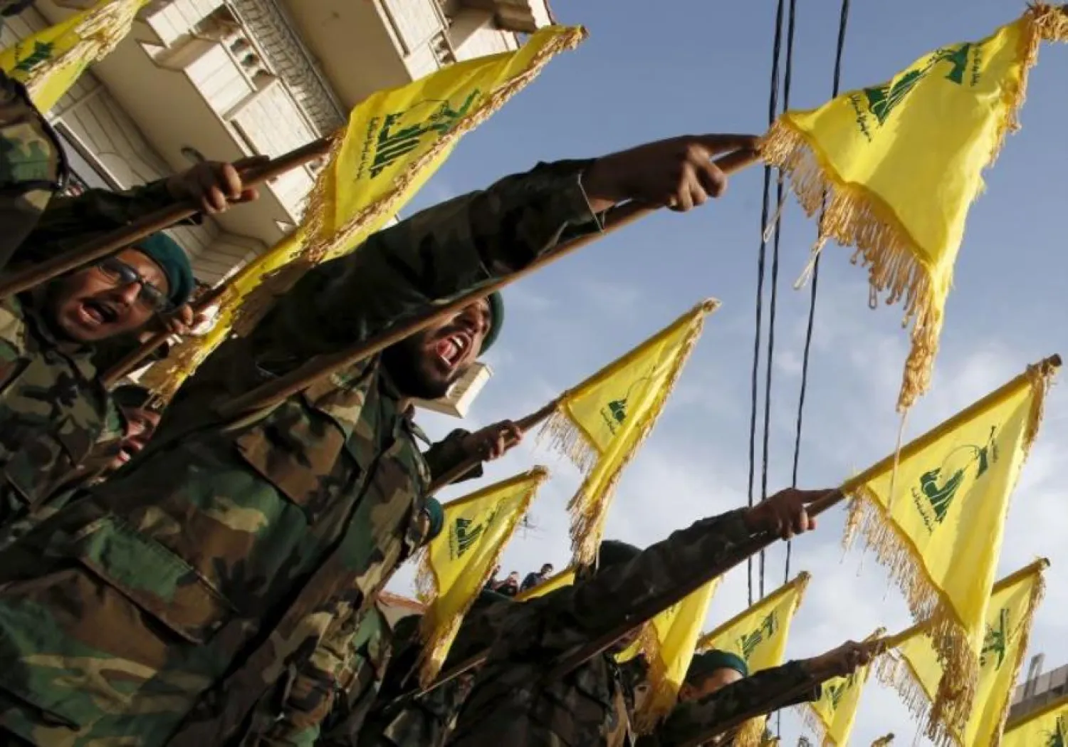 Lebanon's Hezbollah members carry Hezbollah flags during the funeral of Adnan Siblini, who was killed while fighting in Syria. (photo credit: REUTERS)