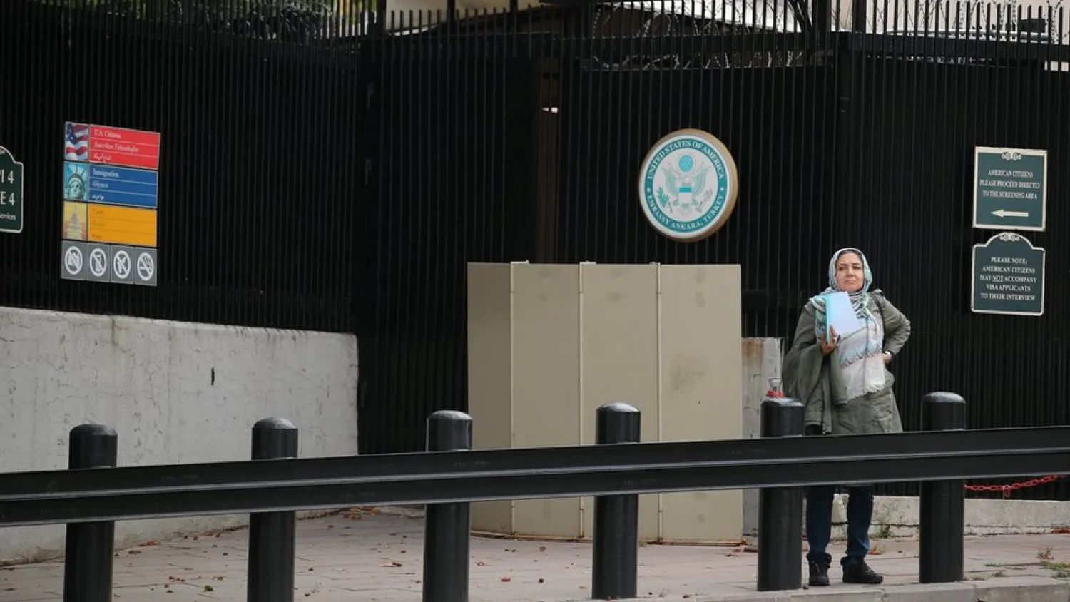 Woman waits at US embassy in Ankara. PHOTO: Reuters