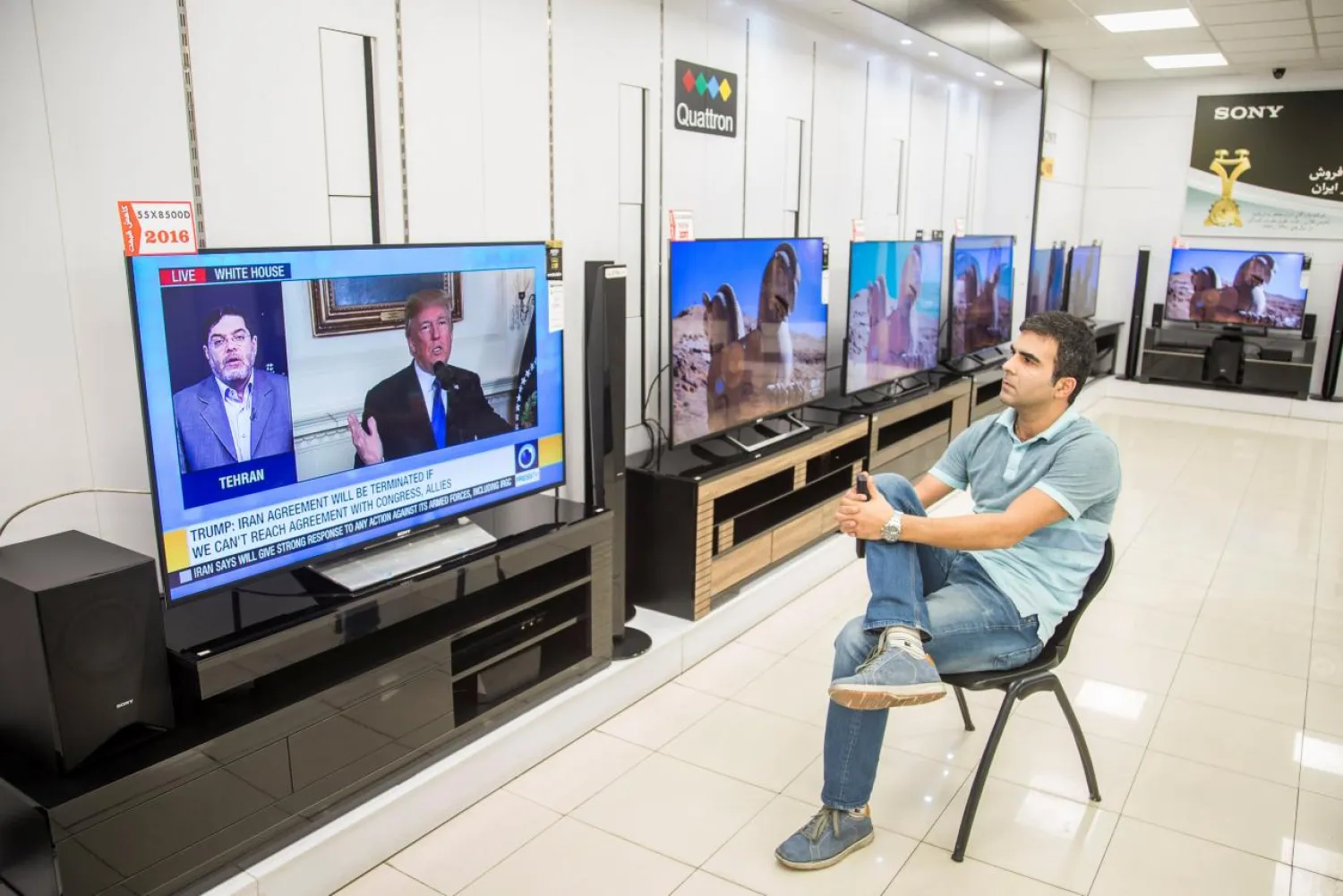 A man watches a television broadcast of US President Donald Trump's speech, in Tehran, Iran October 13, 2017. Nazanin Tabatabaee Yazdi/TIMA via REUTERS