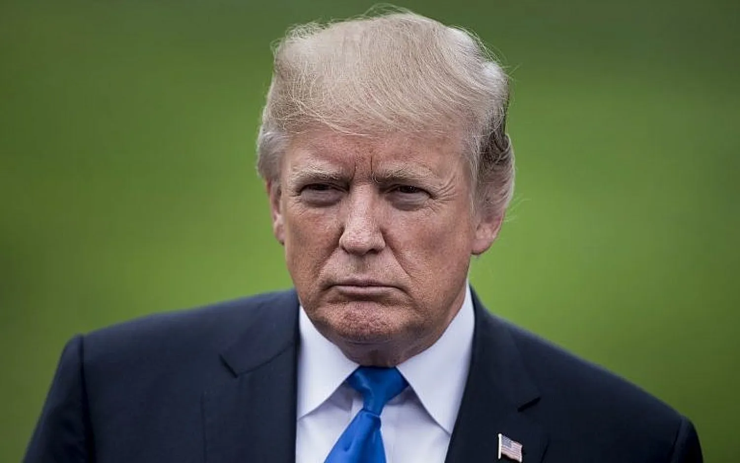 US President Donald Trump pauses while speaking to the press on the South Lawn of the White House October 13, 2017, in Washington, DC. (AFP PHOTO / Brendan Smialowski)