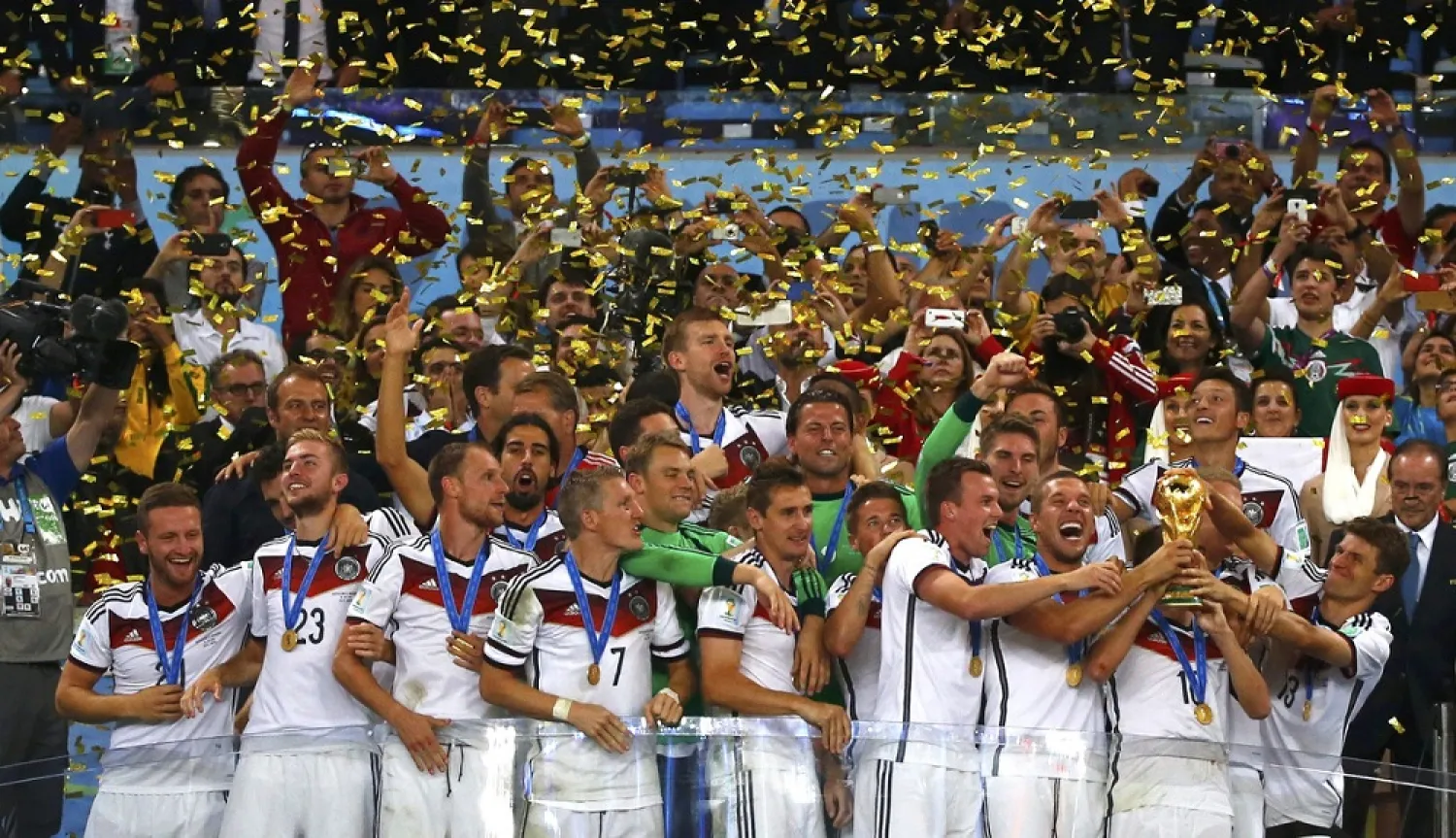 Germany players celebrate with their trophy after winning the 2014 World Cup final between Germany and Argentina at the Maracana stadium in Rio de Janeiro July 13, 2014. (Reuters)