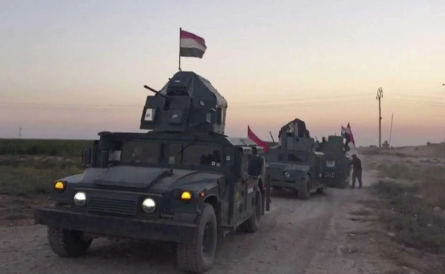 This image made from a video shows Iraqi soldiers on military vehicles in the Qatash area towards Kirkuk gas plant, south of Kirkuk, Iraq, Monday, Oct. 16, 2017. (AP)