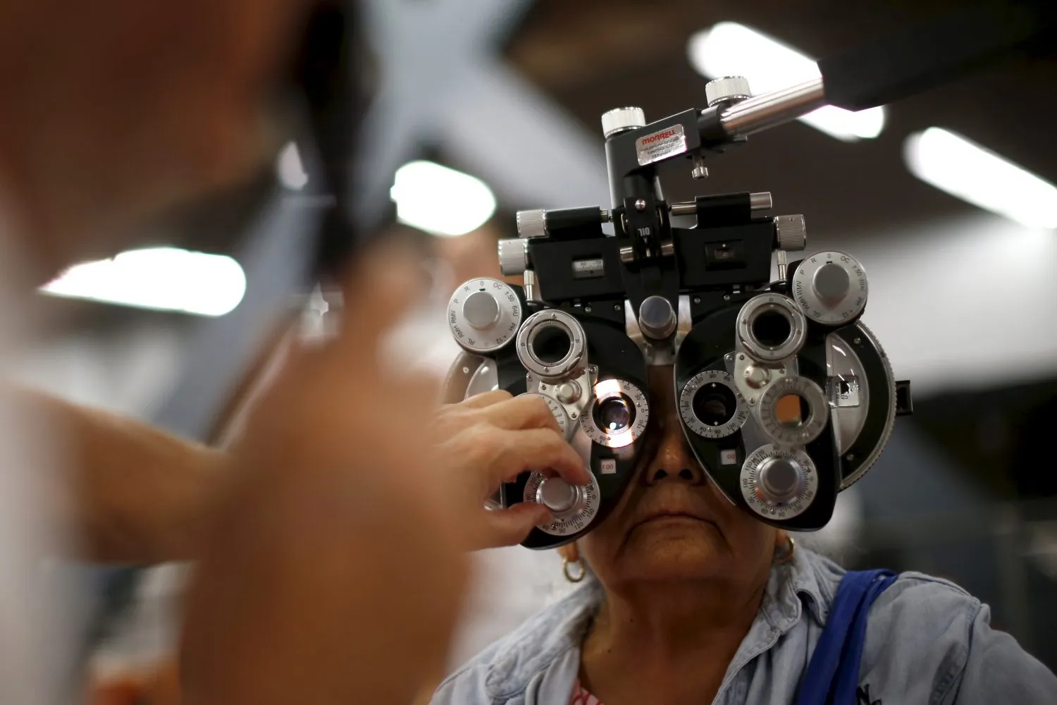  A woman has her eyes tested at the Care Harbor four-day free
clinic, which offers free medical, dental and vision care to around
4,000 uninsured people in Los Angeles. Photo by Lucy Nicholson/Reuters