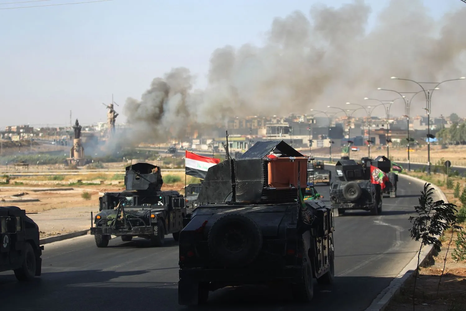 Iraqi forces advance toward the center of Kirkuk during an operation on Oct. 16. AFP