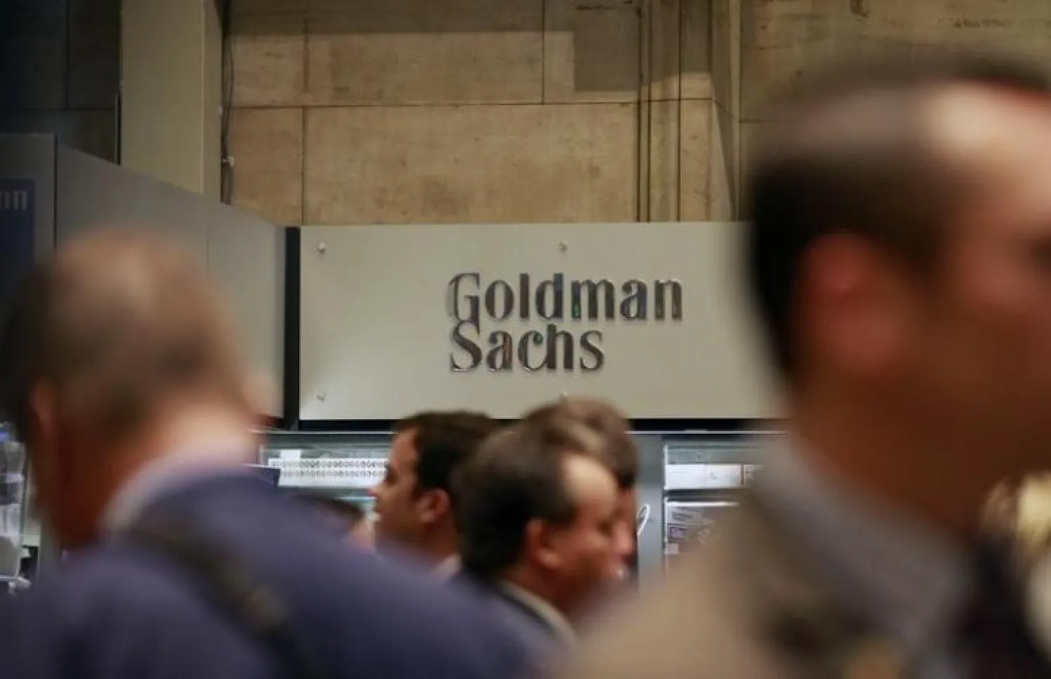 Traders work on the floor of the New York Stock Exchange near the Goldman Sachs stall. (Reuters)