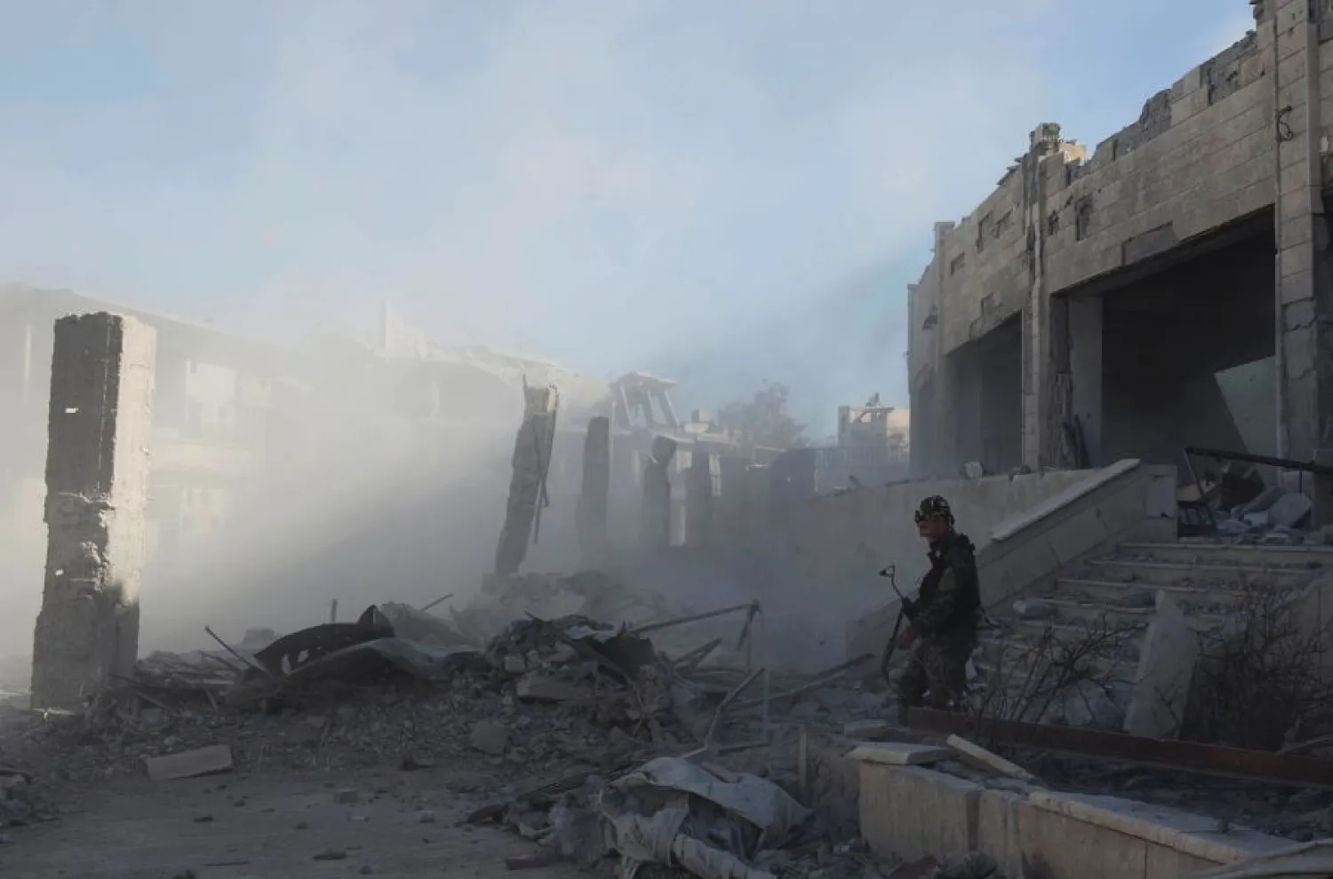 A member of the US-backed Syrian Democratic Forces (SDF) defuses a bomb left by ISIS militants at the stadium that was the site of the group’s last stand in the city of Raqqa, Syria, Wednesday, Oct. 18, 2017. (AP)