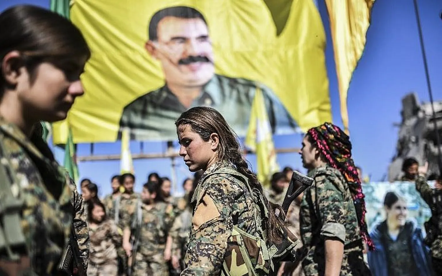  Female fighters from the Syrian Democratic Forces are seen at a celebration in Raqqa on October 19, 2017, after retaking the city from the Islamic State. (AFP Photo/Bulent Kilic)