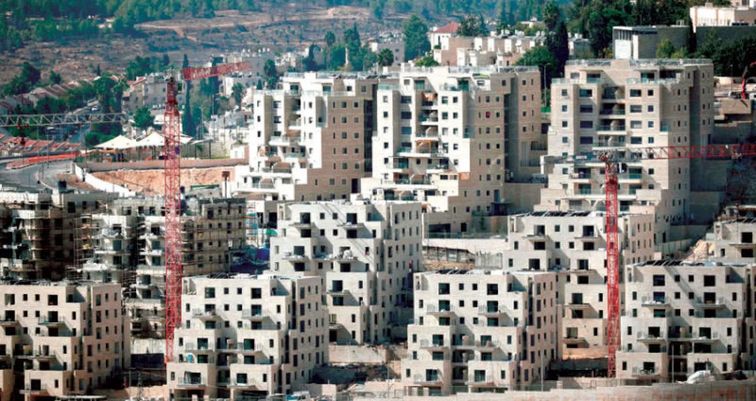منازل قيد الإنشاء في إحدى المستوطنات الإسرائيلية في القدس الشرقية (أ.ف.ب)