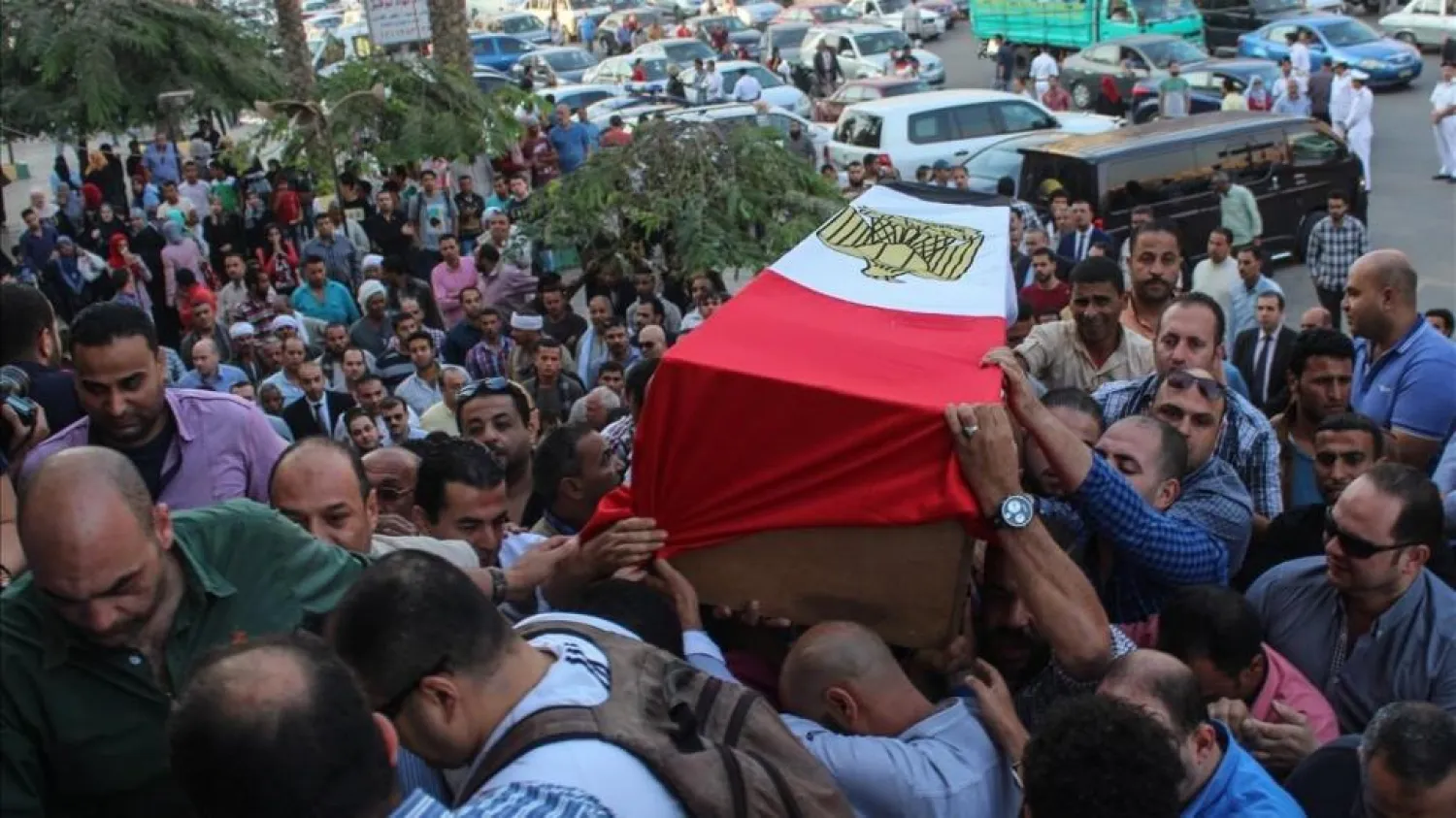 People carry the coffin of Egyptian police captain Ahmed Fayez, EPA