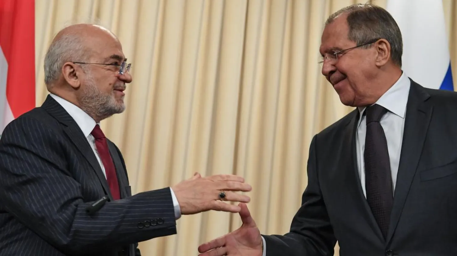 Russian foreign minister Sergey Lavrov (R) shakes hands with his Iraqi counterpart, Ibrahim Al Jaafari, at the end of a joint press conference following their meeting in Moscow on October 23, 2017. Kirill Kudryavtsev / AFP