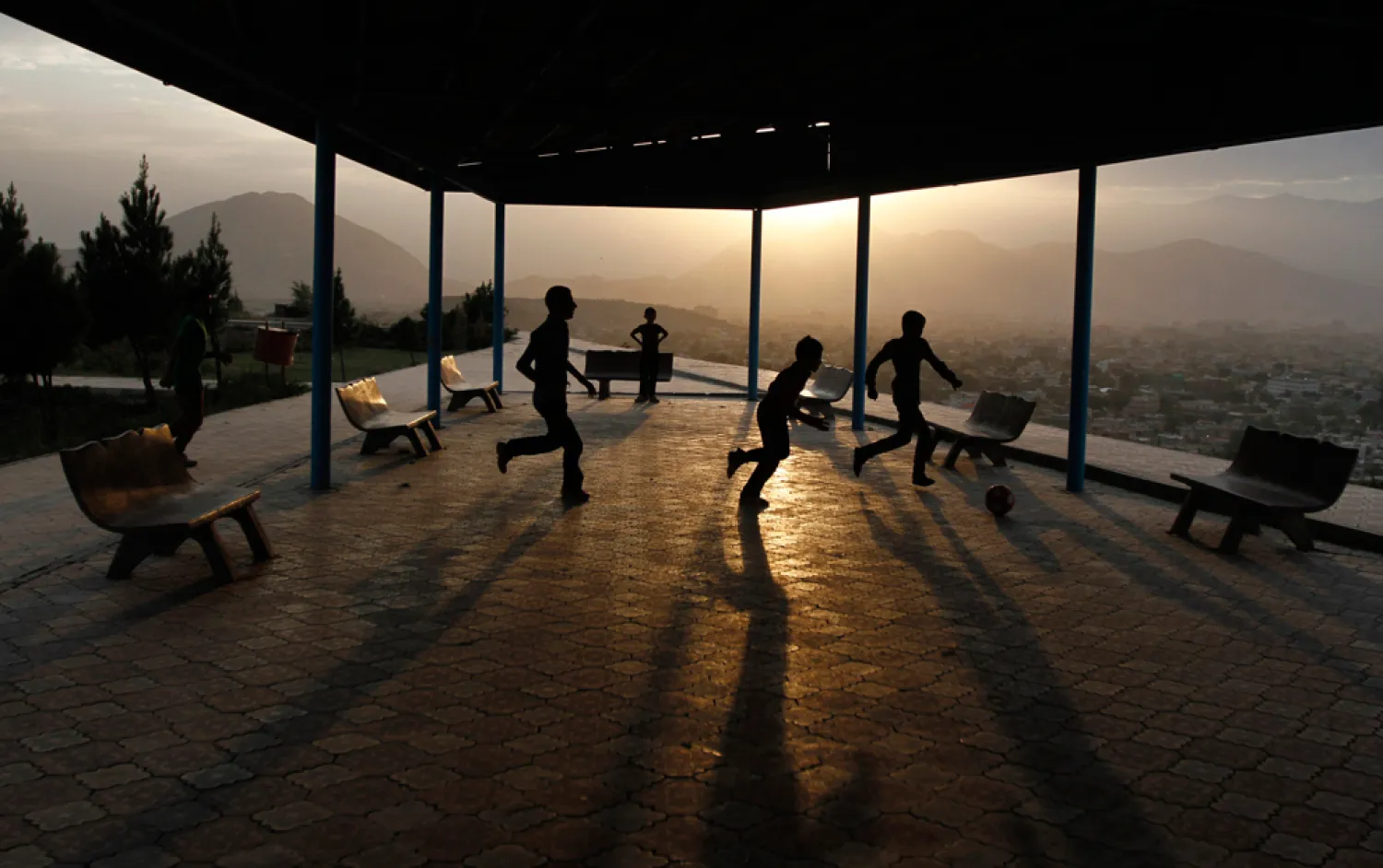Afghan boys play football on a hill in Kabul on September 11, 2012. (Mohammad Ismail/Reuters)