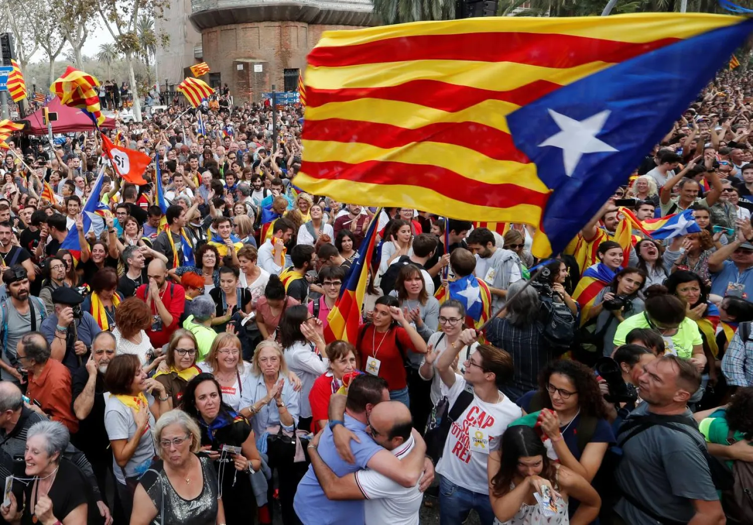 People celebrate after the Catalan regional parliament passes the vote of independence from Spain in Barcelona, Spain October 27, 2017. REUTERS/Yves Herman