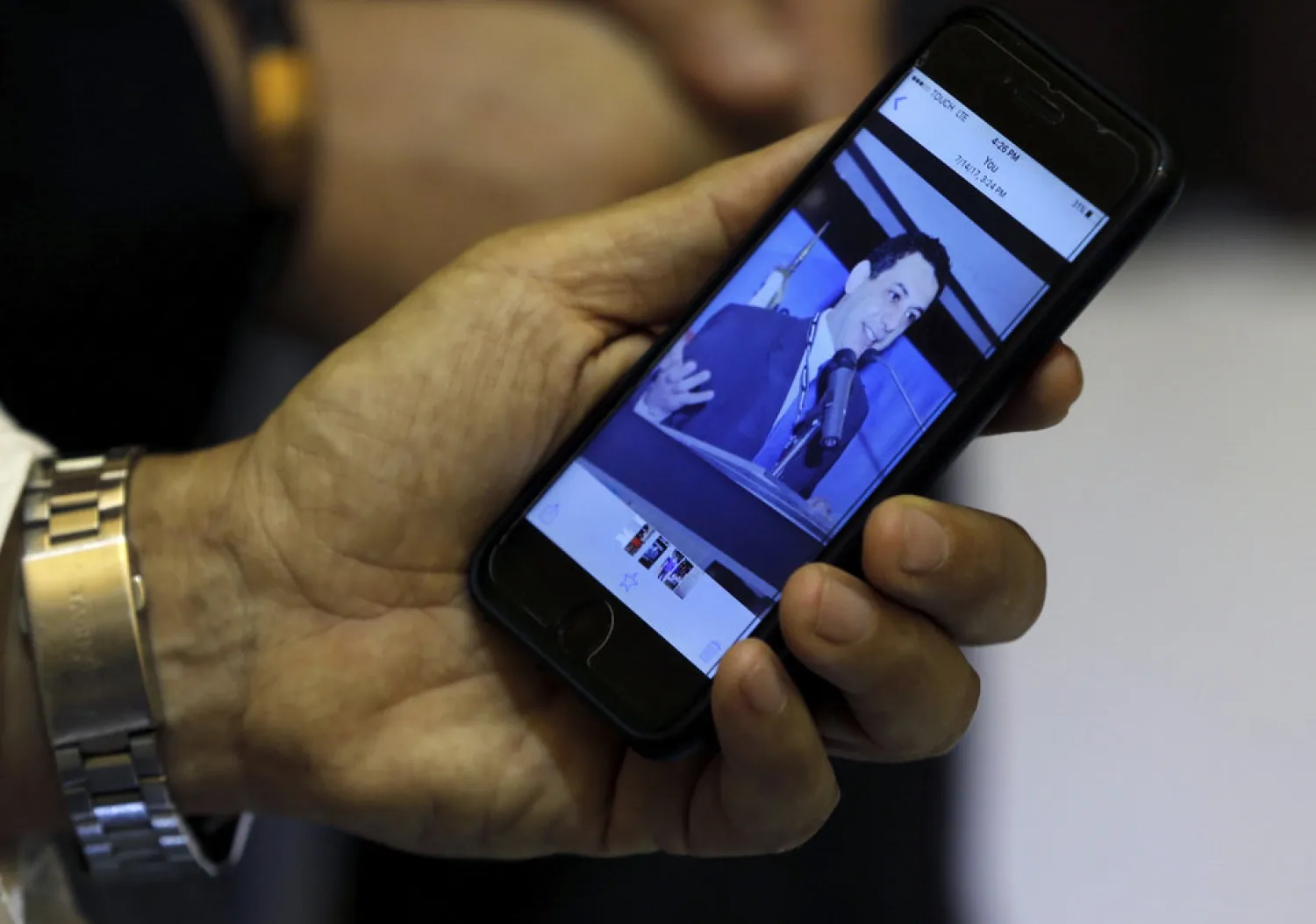 Ziad Zakka, brother of Nizar Zakka who is imprisoned in Iran, shows a photo of his brother on his mobile phone in Beirut, Lebanon, Tuesday, July 18, 2017. (AP Photo/Bilal Hussein) 