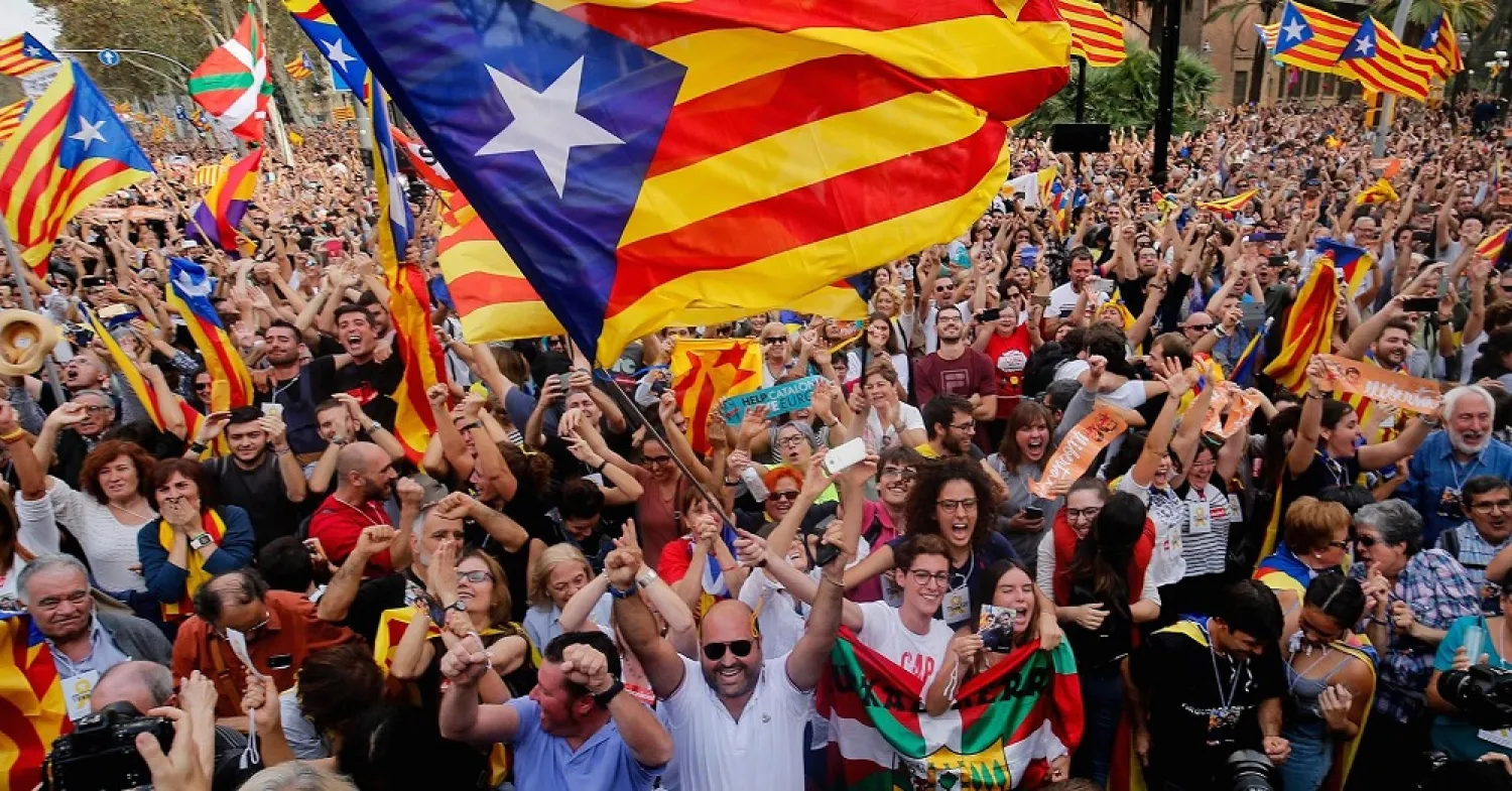 People celebrate after the Catalan regional parliament declares independence. (Getty Images)