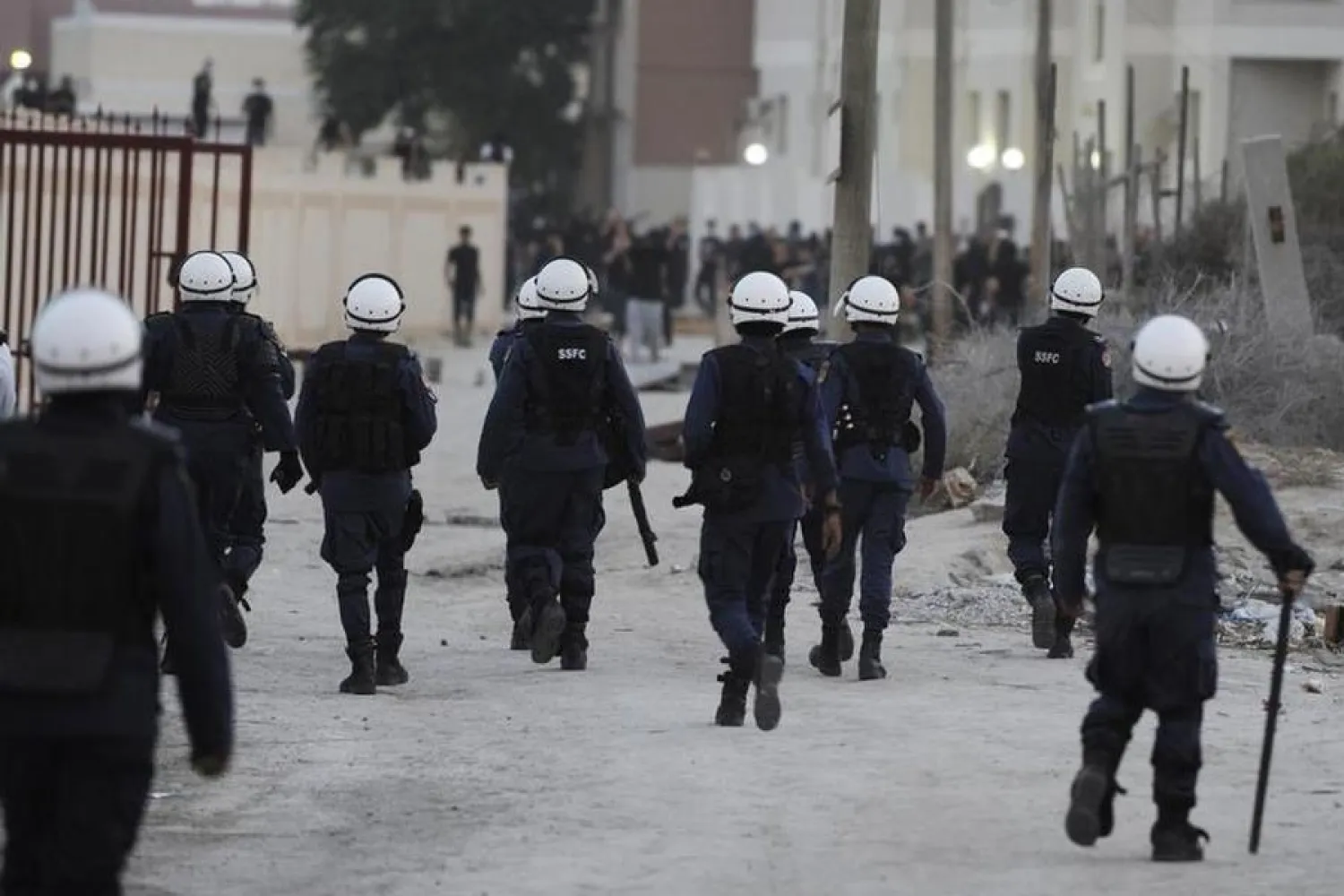 Riot police walk towards protesters during clashes in the village of Daih, west of Manama. Reuters