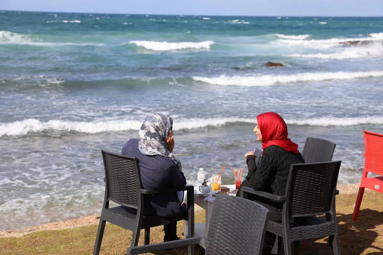 Women sit at a cafe on a beach in Tripoli, Libya October 28, 2017. Picture taken October 28, 2017. REUTERS/Hani Amara