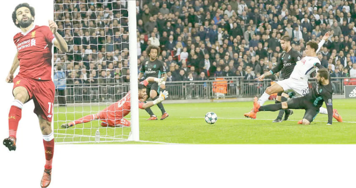 ديلي ألي نجم توتنهام (في الوسط) يسجل هدفه الأول في مرمى ريال مدريد (أ.ب)  - صلاح نجم ليفربول يحتفل بهدفه (أ.ب)