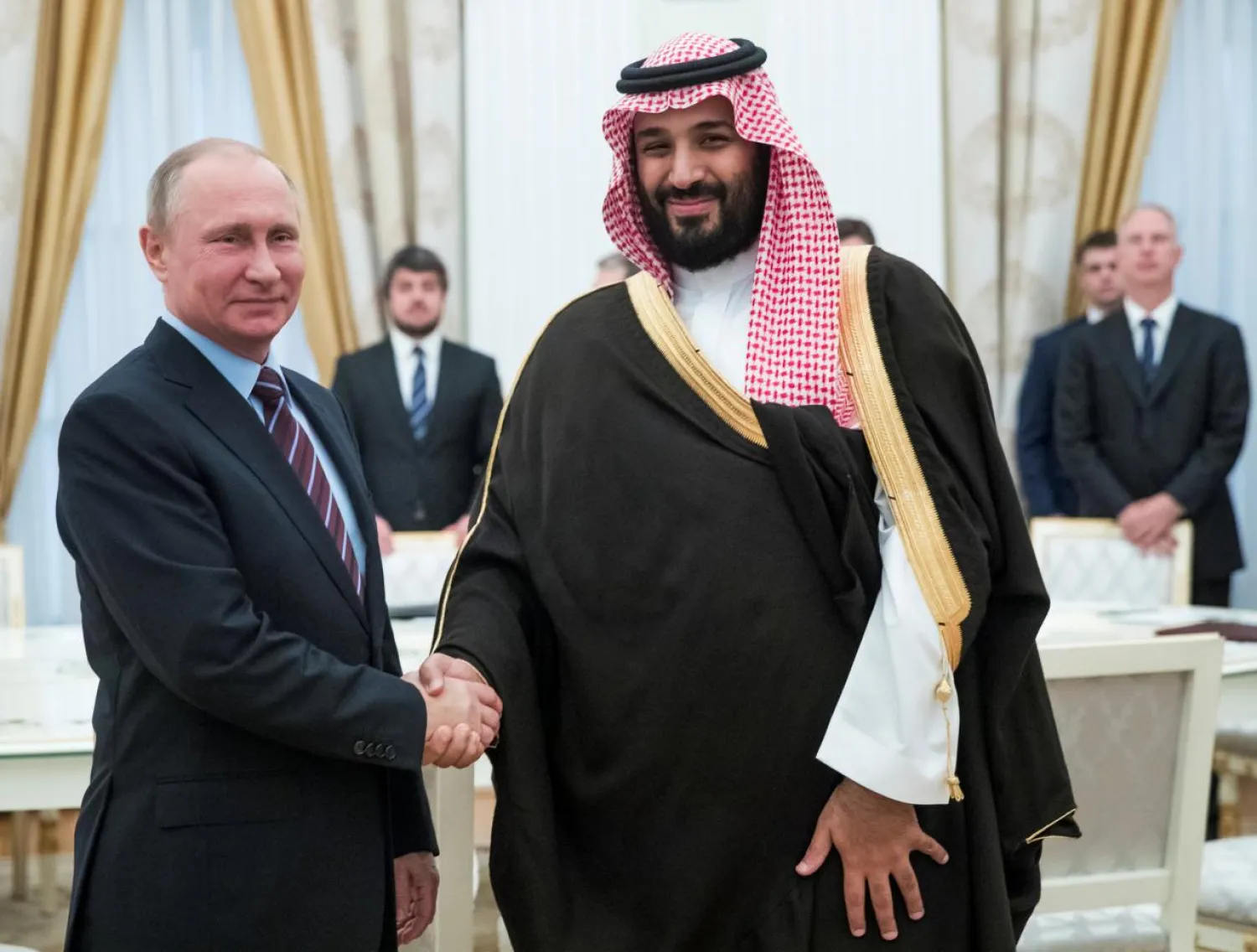 Russian President Vladimir Putin shakes hands with Saudi Crown Prince and Defense Minister Mohammed bin Salman during a meeting at the Kremlin in Moscow, Russia, May 30, 2017. REUTERS/Pavel Golovkin/Pool
