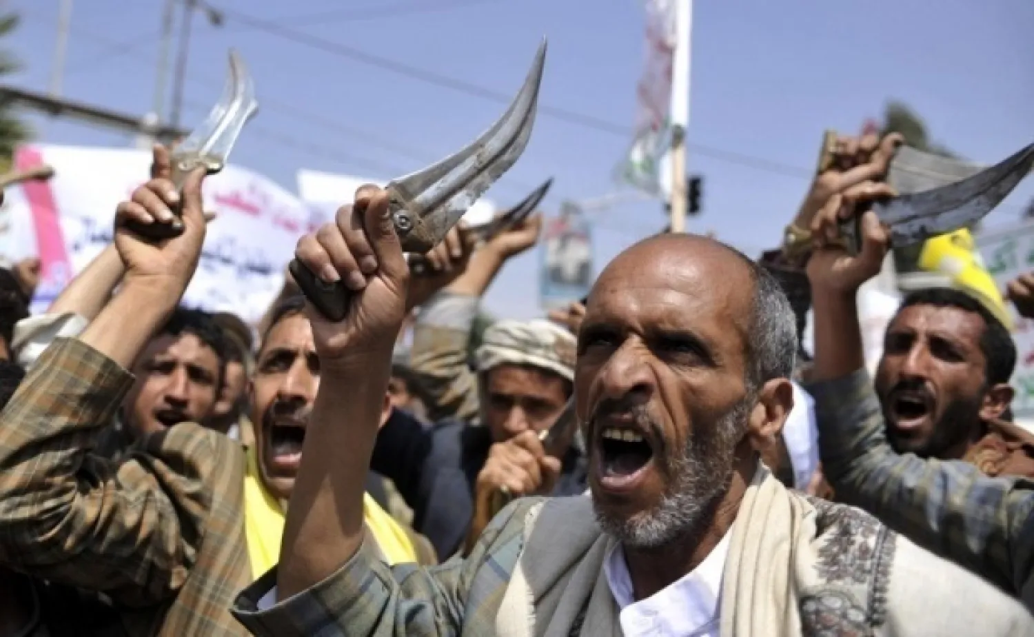 Supporters of Yemen's Houthi militias in the streets of Sanna in 2014 (AFP)