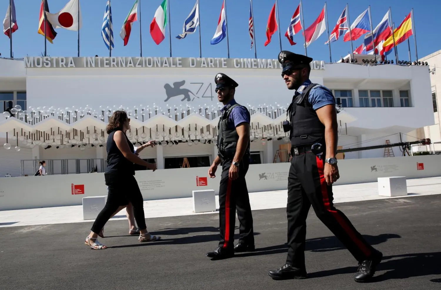 FILE PHOTO - Italian Carabinieri are seen as they patrol in front of the entrance of the Palazzo del Cinema a day before the opening of the 74th Venice Film Festival in Venice, Italy August 29, 2017. REUTERS/Alessandro Bianchi