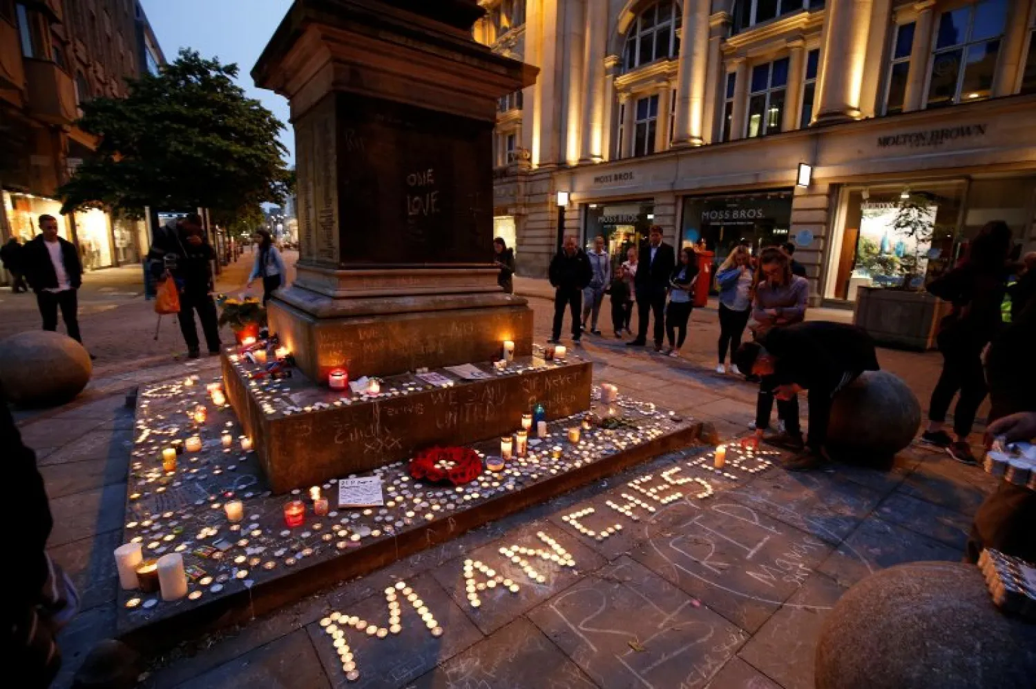 People attend a vigil for the victims of the Manchester Arena attack, in central Manchester, Britain May 29, 2017. REUTERS/Andrew Yates 