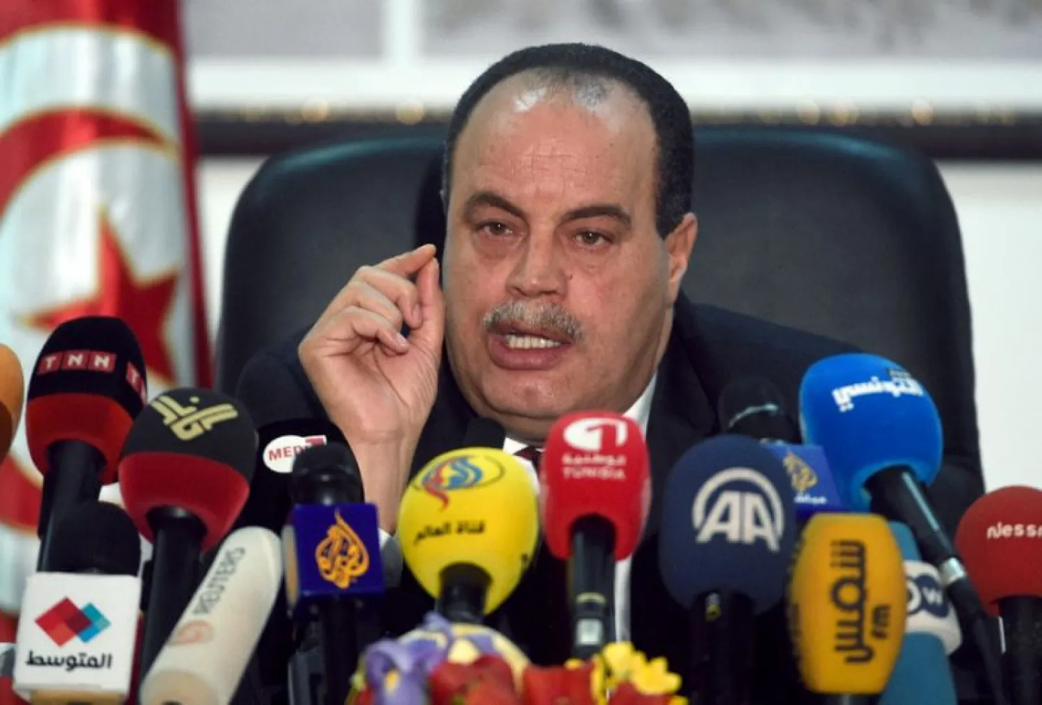 Tunisian Interior Minister Mohamed Najem Gharsalli speaks with journalists during a press conference on March 26, 2015 in Tunis (AFP Photo/Fethi Belaid)

