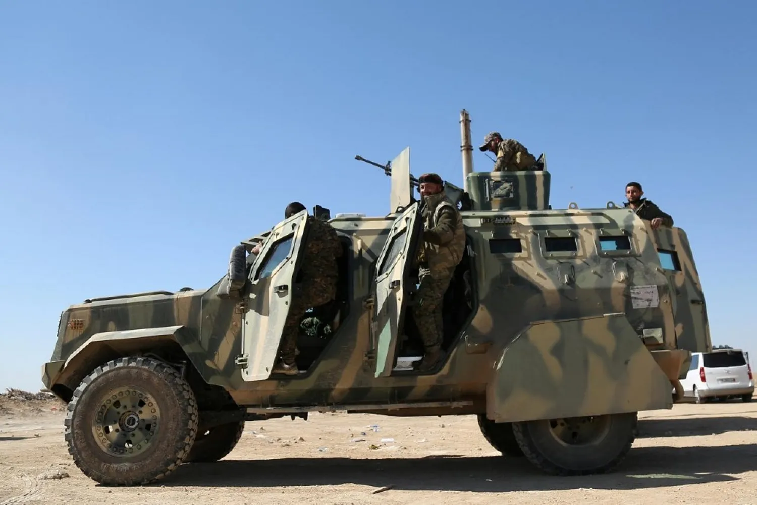 Syrian Democratic Forces stand on their military vehicle in northern Deir al-Zour province ahead of an offensive against ISIS. (Reuters)